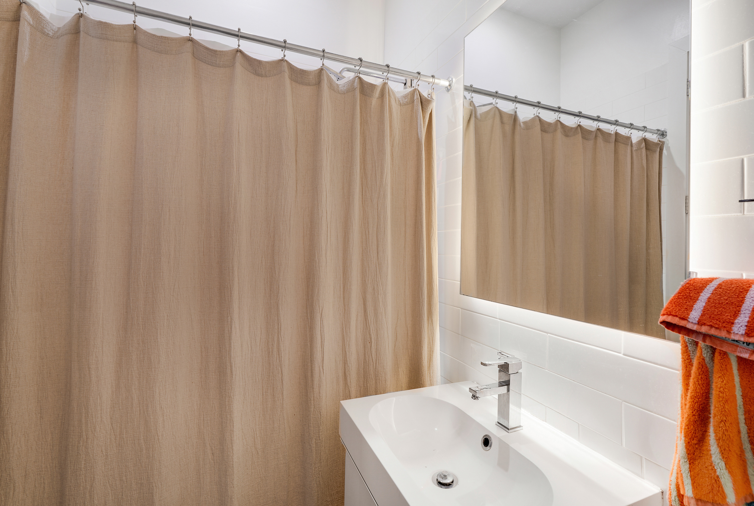 622 Grand Avenue, Unit 102 Brooklyn, NY 11238 - Photo 11 of 13 a bathroom with a sink and a mirror