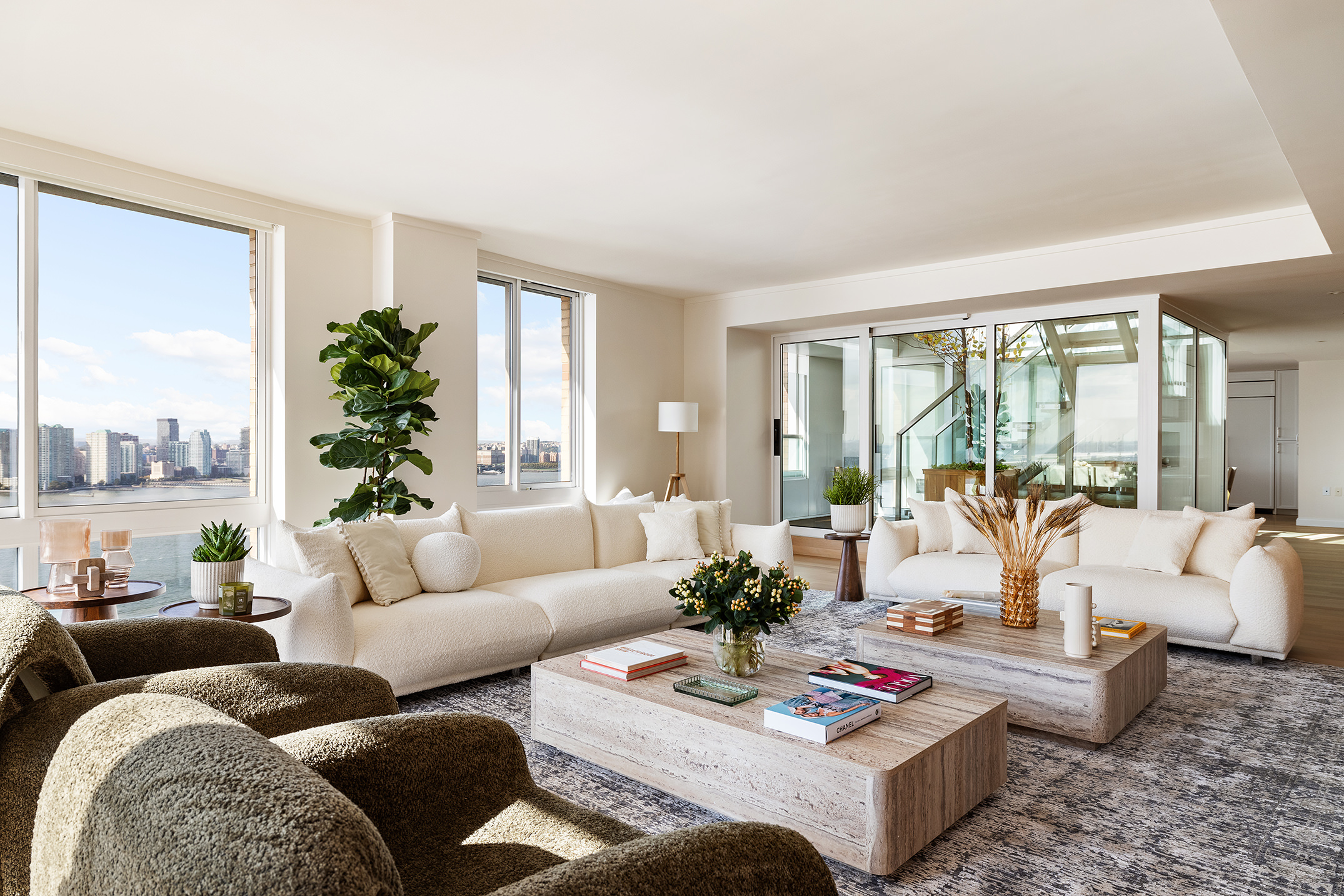 212 Warren Street, Unit PHS Manhattan, NY 10282 - Photo 2 of 18 a living room with furniture and a large window