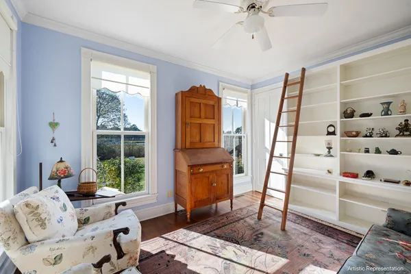 a bedroom with two beds and painting on the wall