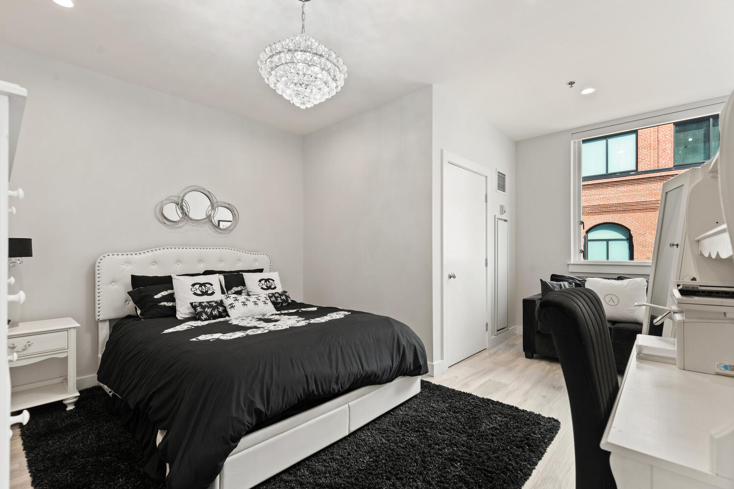 234 Causeway Street, Unit 709 Boston, MA 02114 - Photo 13 of 28 a bedroom with a bed and wooden floor