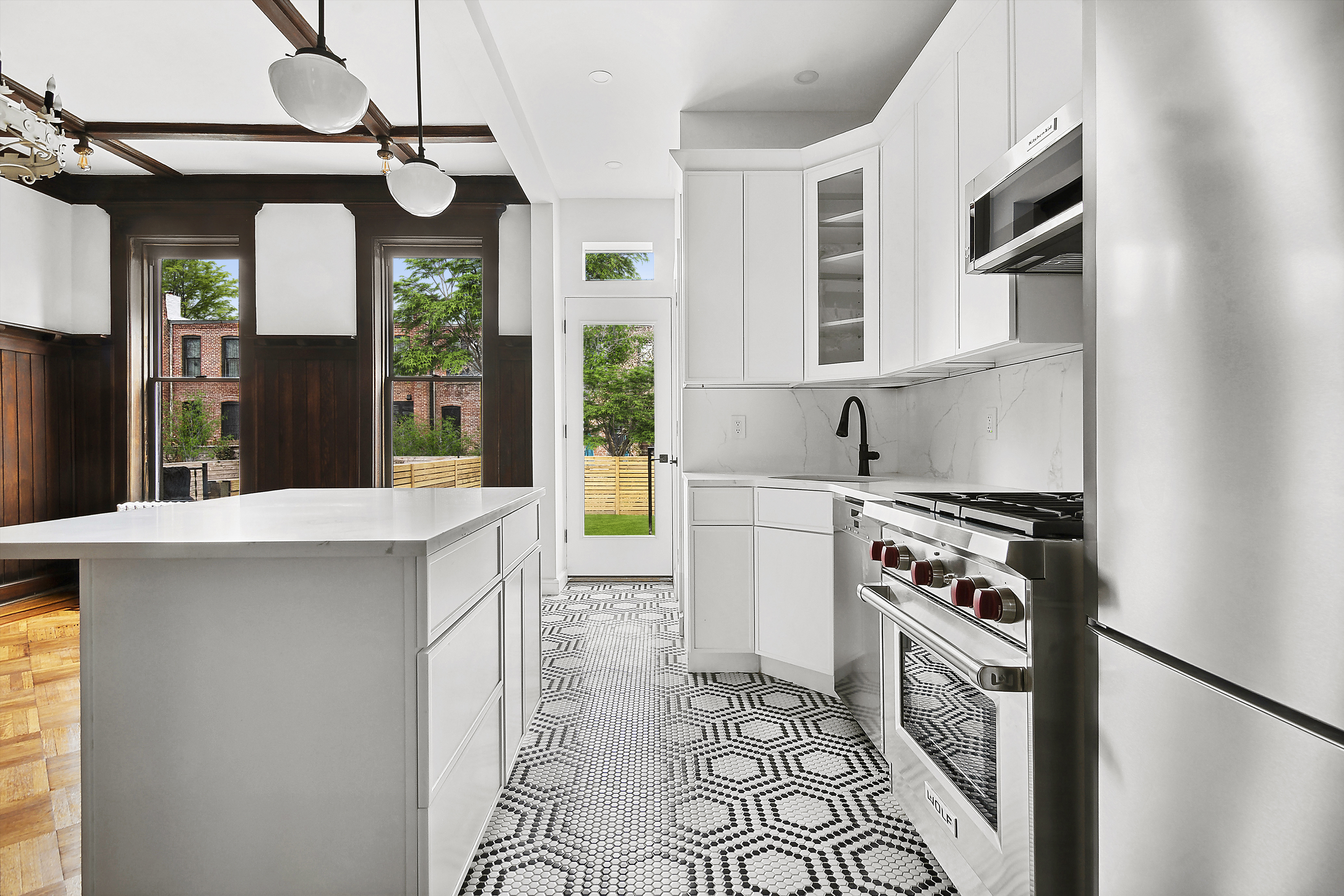 195 Rutland Road Brooklyn, NY 11225 - Photo 8 of 21 a kitchen with stainless steel appliances granite countertop a stove a sink and a refrigerator