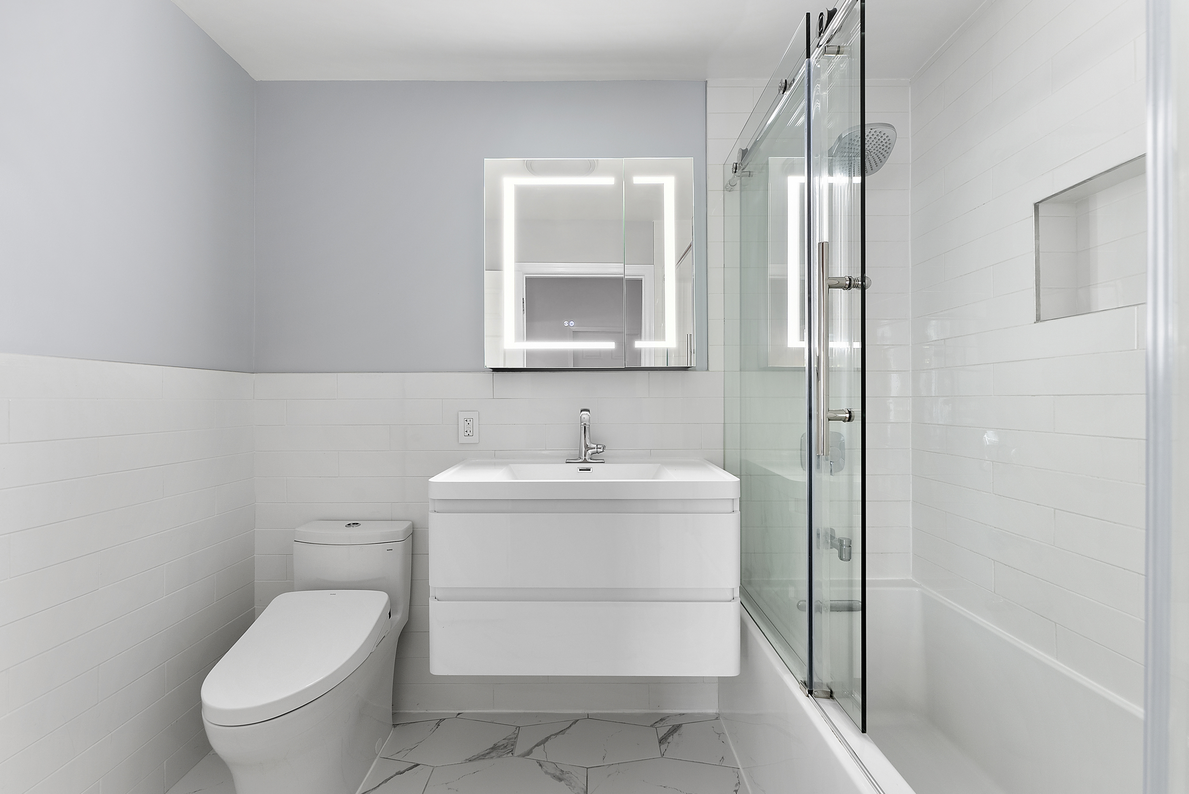 768 Hart Street, Unit 1 Brooklyn, NY 11237 - Photo 12 of 18 a bathroom with a sink toilet and shower