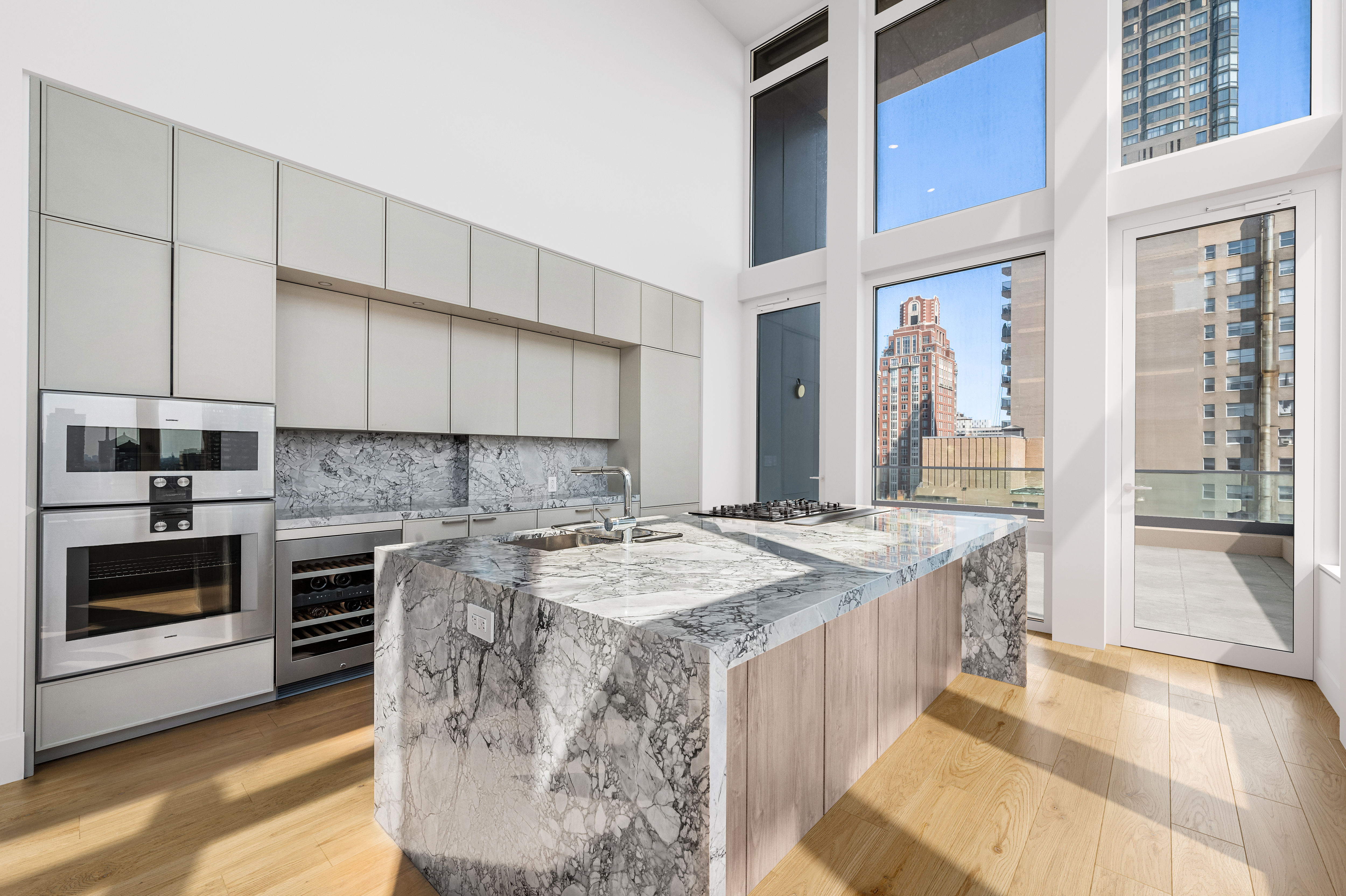 1059 3rd Avenue, Unit 22A Manhattan, NY 10065 - Photo 4 of 13 a kitchen with a stove and a sink