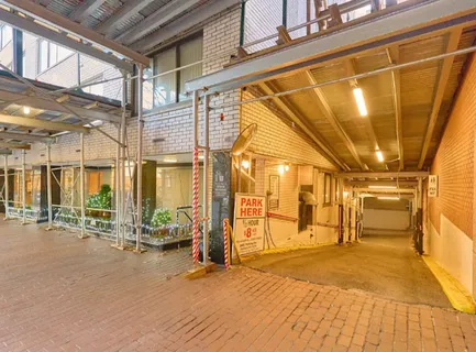 a living room with fireplace furniture and a large window