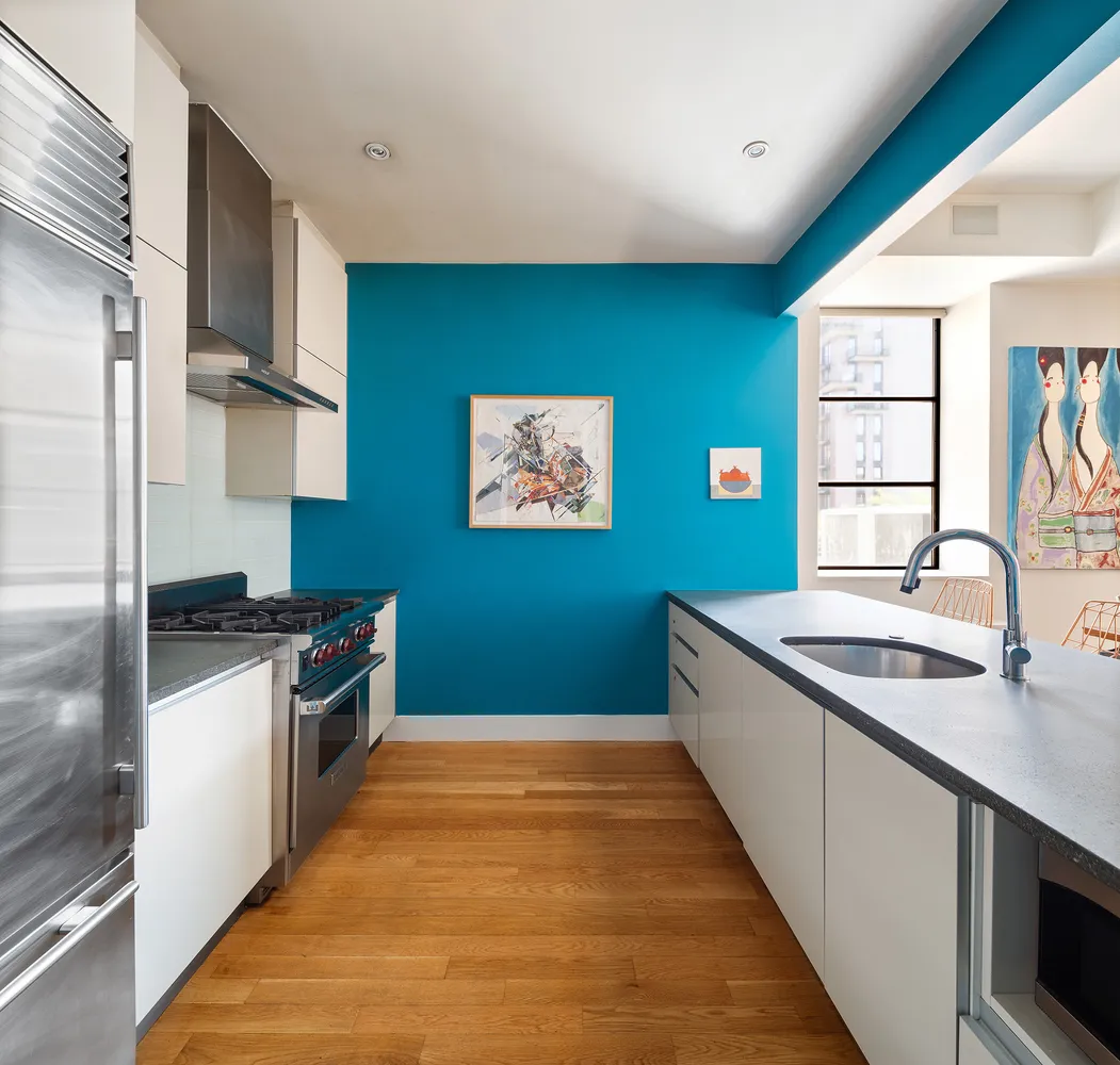 a kitchen with stainless steel appliances granite countertop a sink and a stove