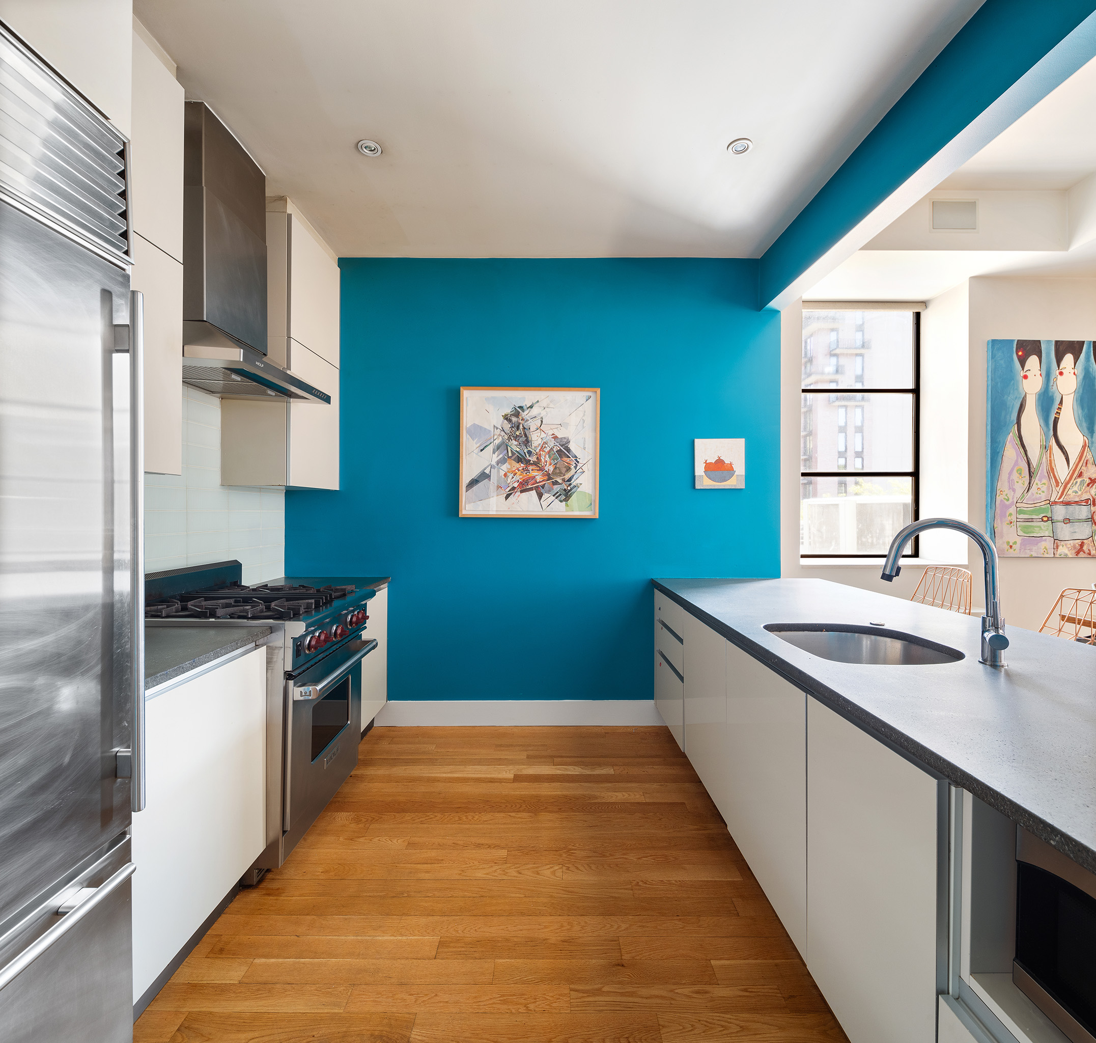 267 West 124th Street, Unit 4B Manhattan, NY 10027 - Photo 5 of 15 a kitchen with stainless steel appliances granite countertop a sink and a stove