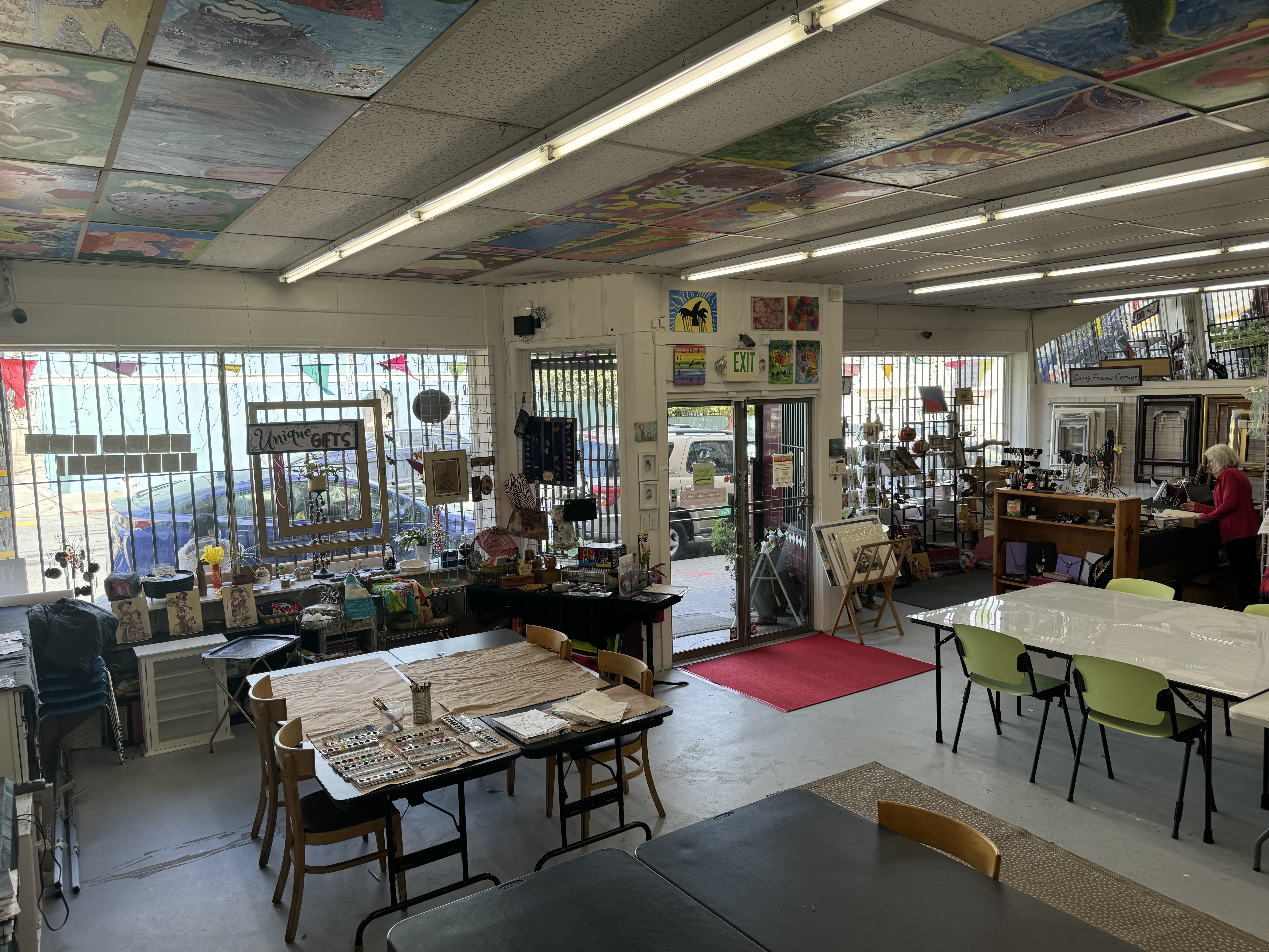153 Bacon Street San Francisco, CA 94134 - Photo 4 of 26 a living room with furniture a rug and a chandelier