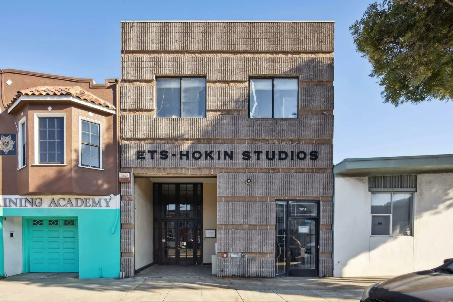 a front view of a building with garden