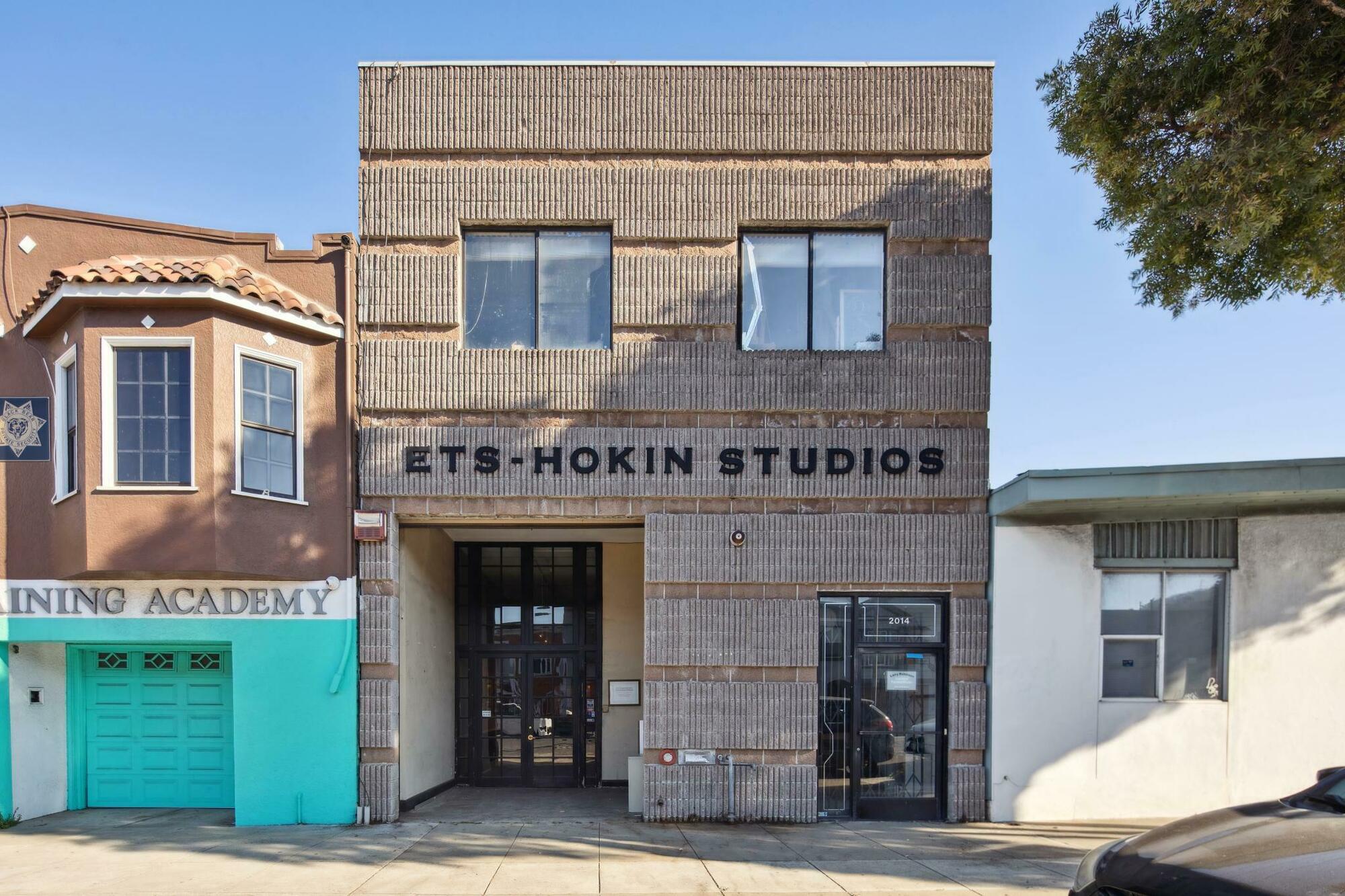 a front view of a building with garden