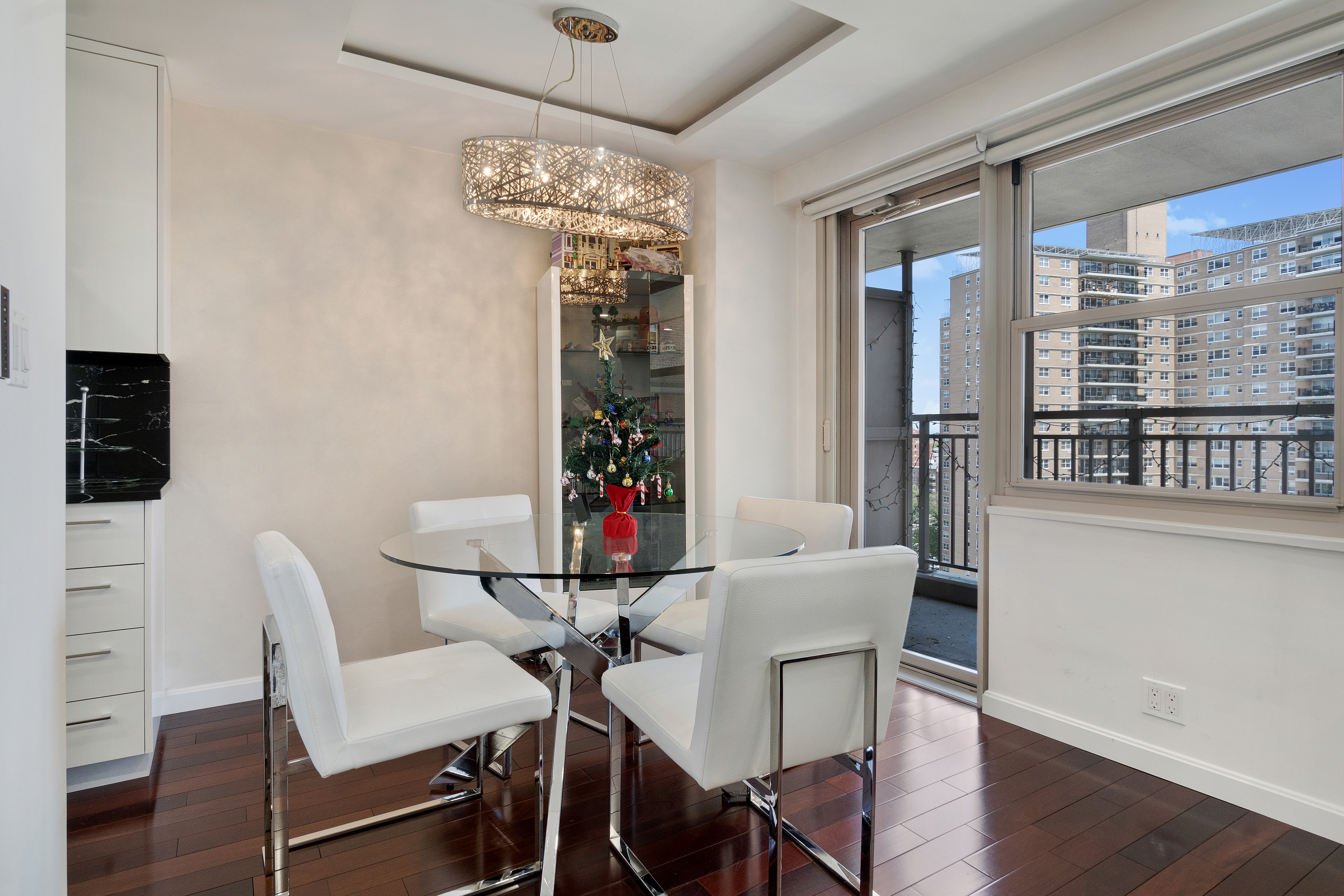 448 Neptune Avenue, Unit 14L Brooklyn, NY 11224 - Photo 7 of 20 a view of a dining room with furniture and chandelier