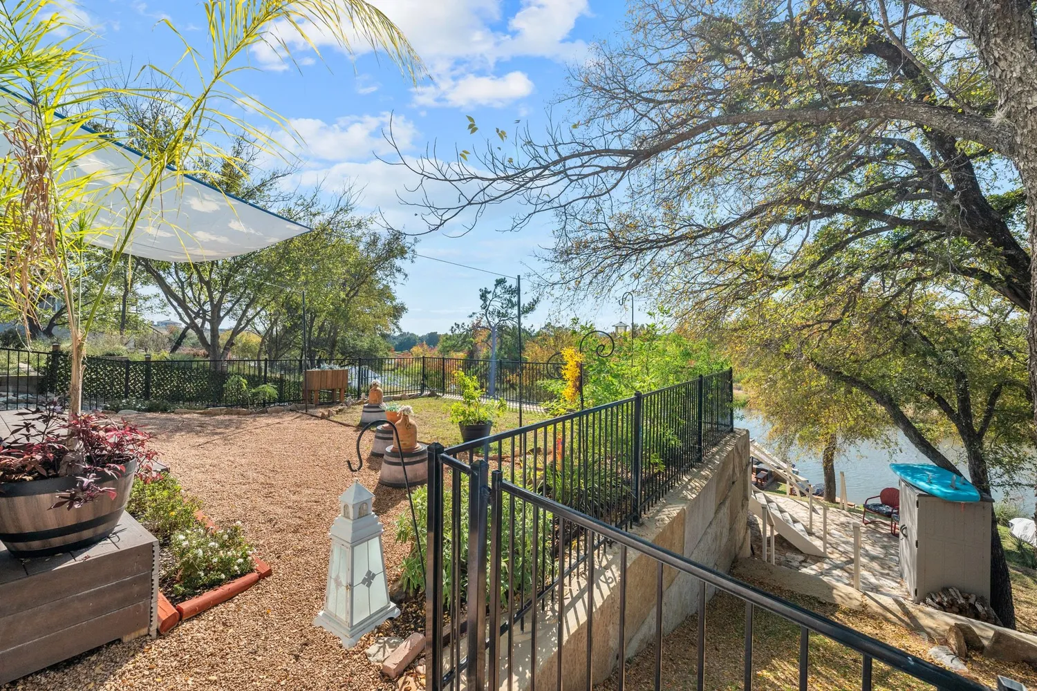 a view of a lake with lawn chairs