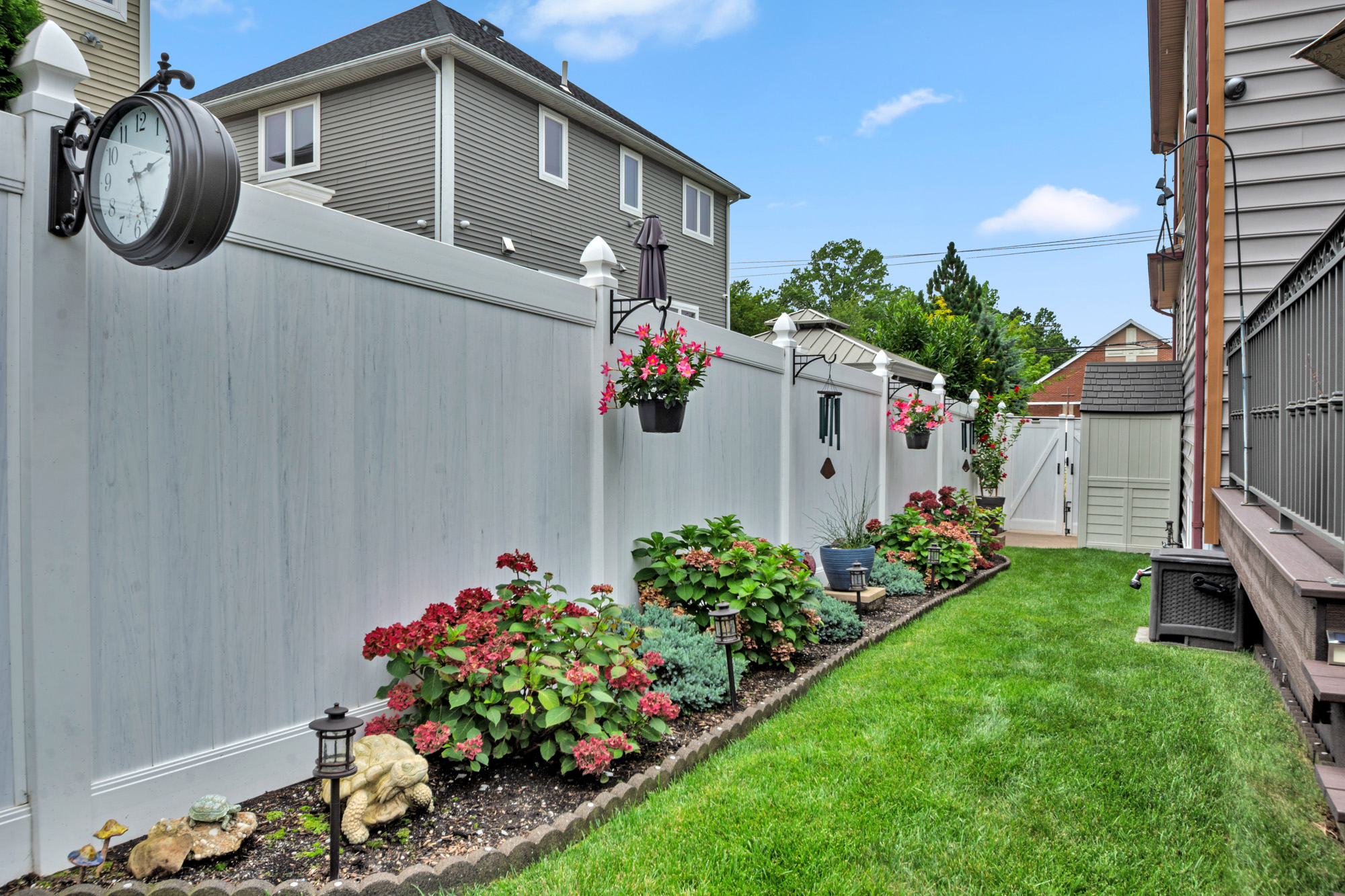 909 Jewett Avenue Staten Island, NY 10314 - Photo 55 of 65 a front view of a house with a yard