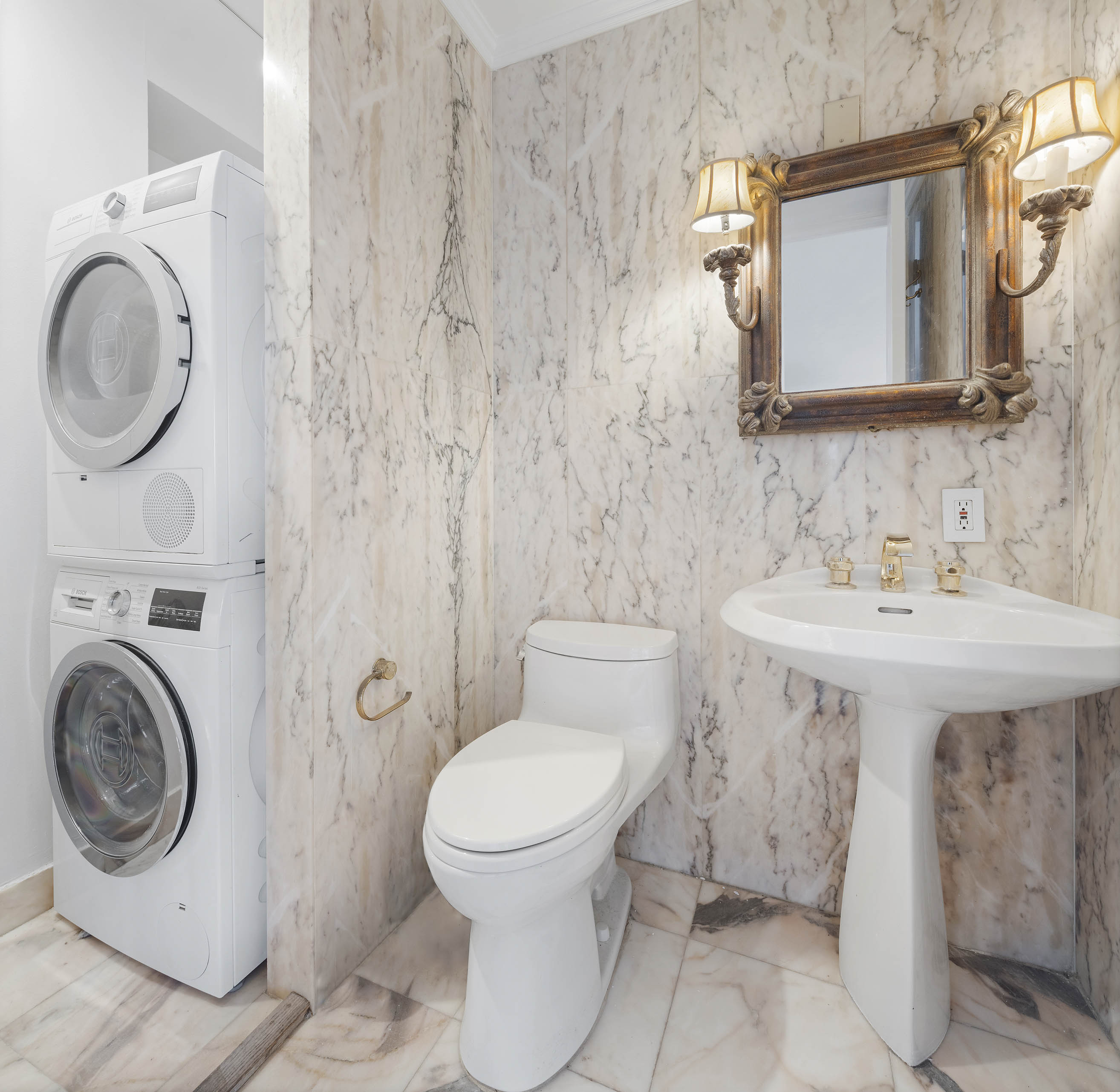 530 East 76th Street, Unit PH36/37E Manhattan, NY 10021 - Photo 19 of 29 a bathroom with a sink a toilet and a mirror