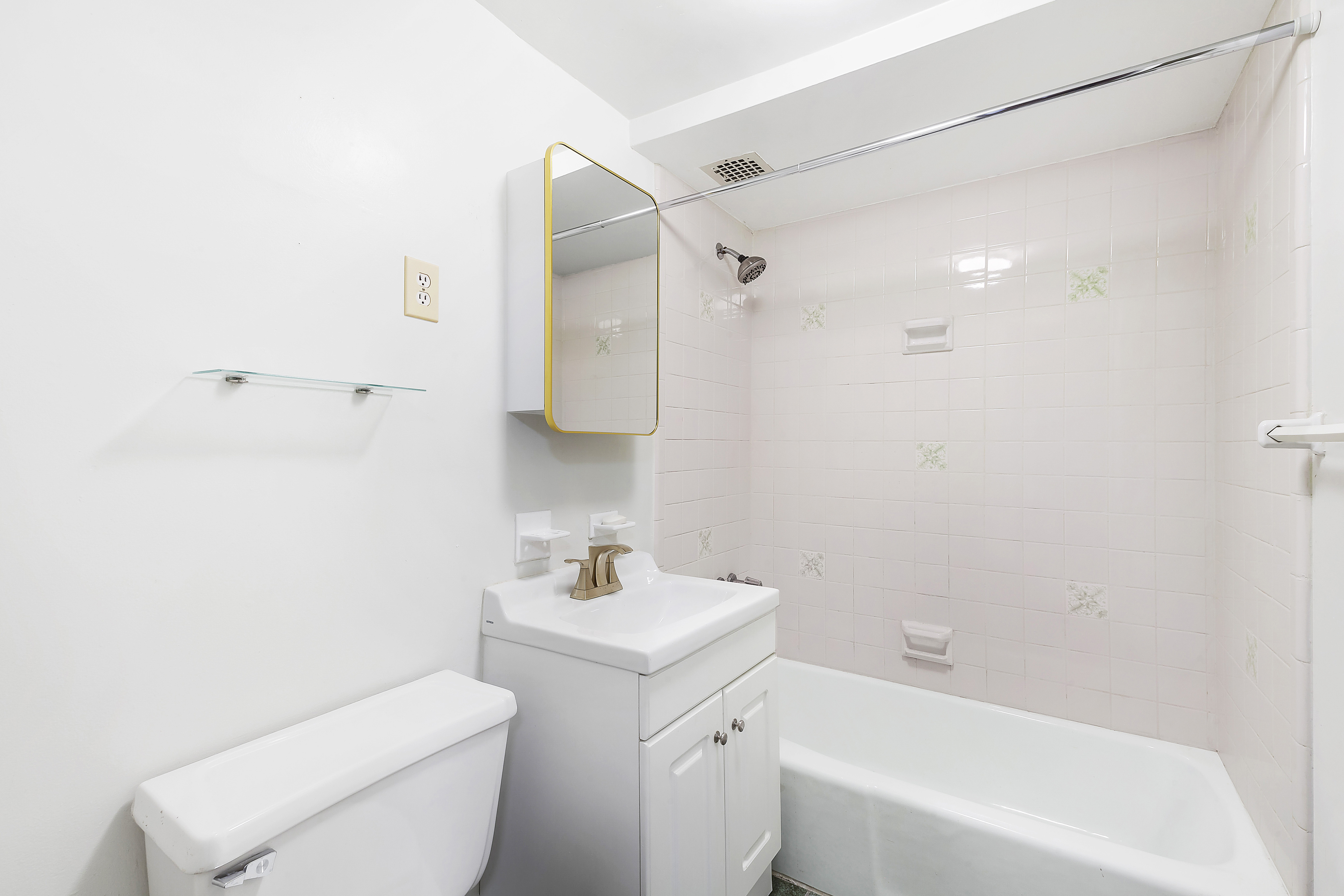 59 East 74th Street, Unit 6A Manhattan, NY 10021 - Photo 4 of 5 a bathroom with a sink toilet and shower