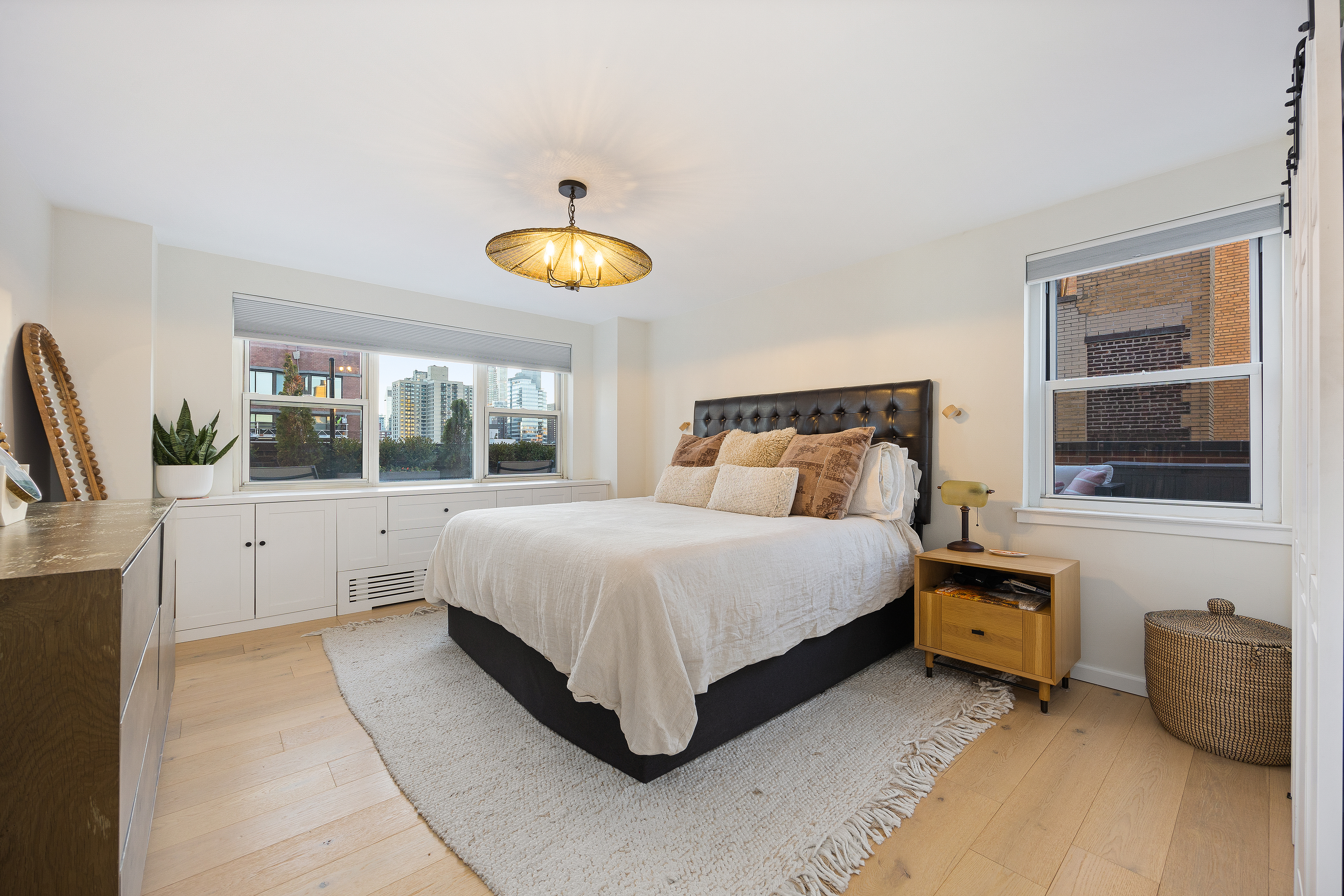 333 East 79th Street, Unit 18N Manhattan, NY 10075 - Photo 7 of 11 a bedroom with a bed and window