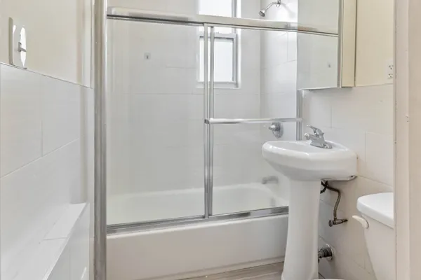 a bathroom with a sink and mirror