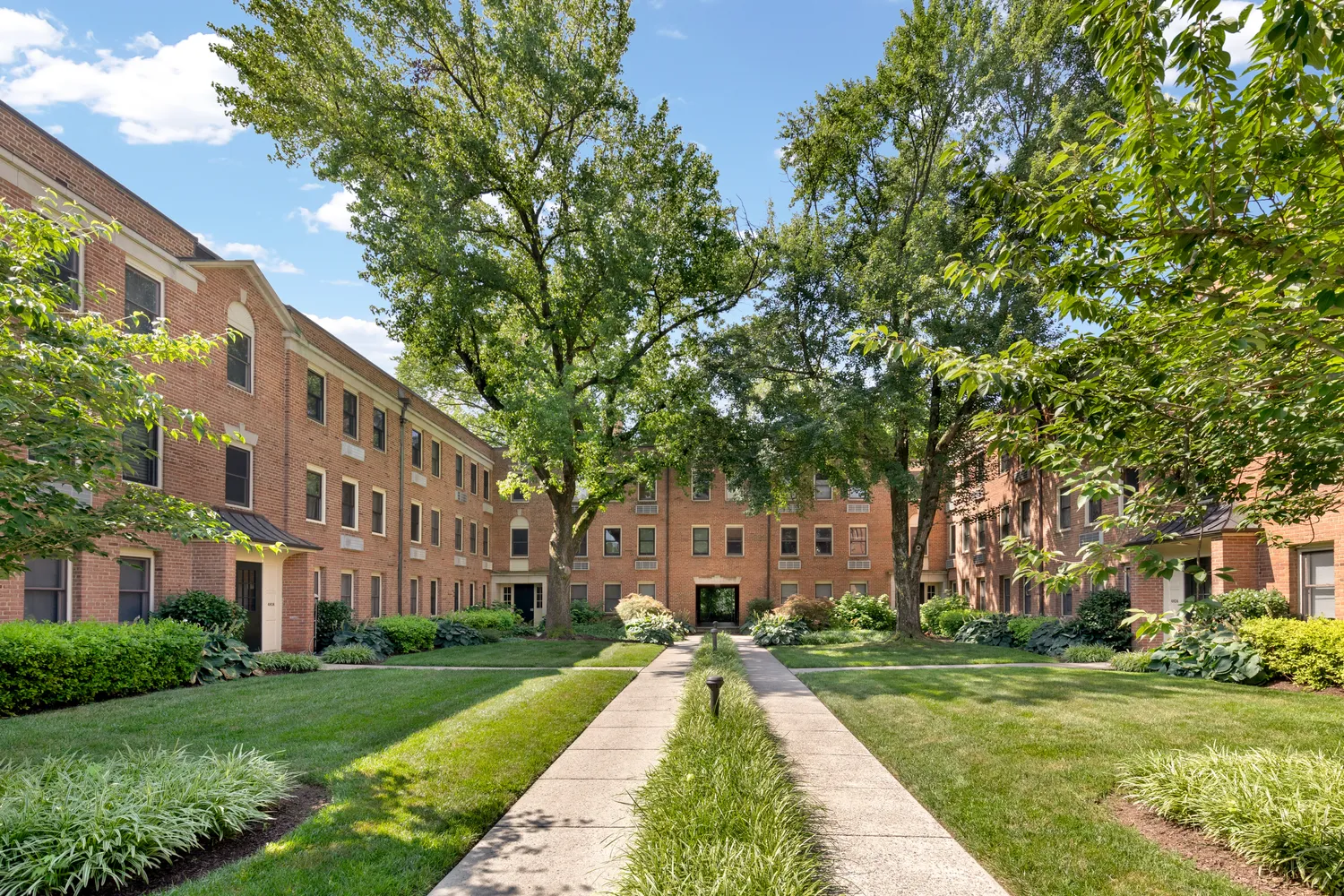 a view of a building with a yard