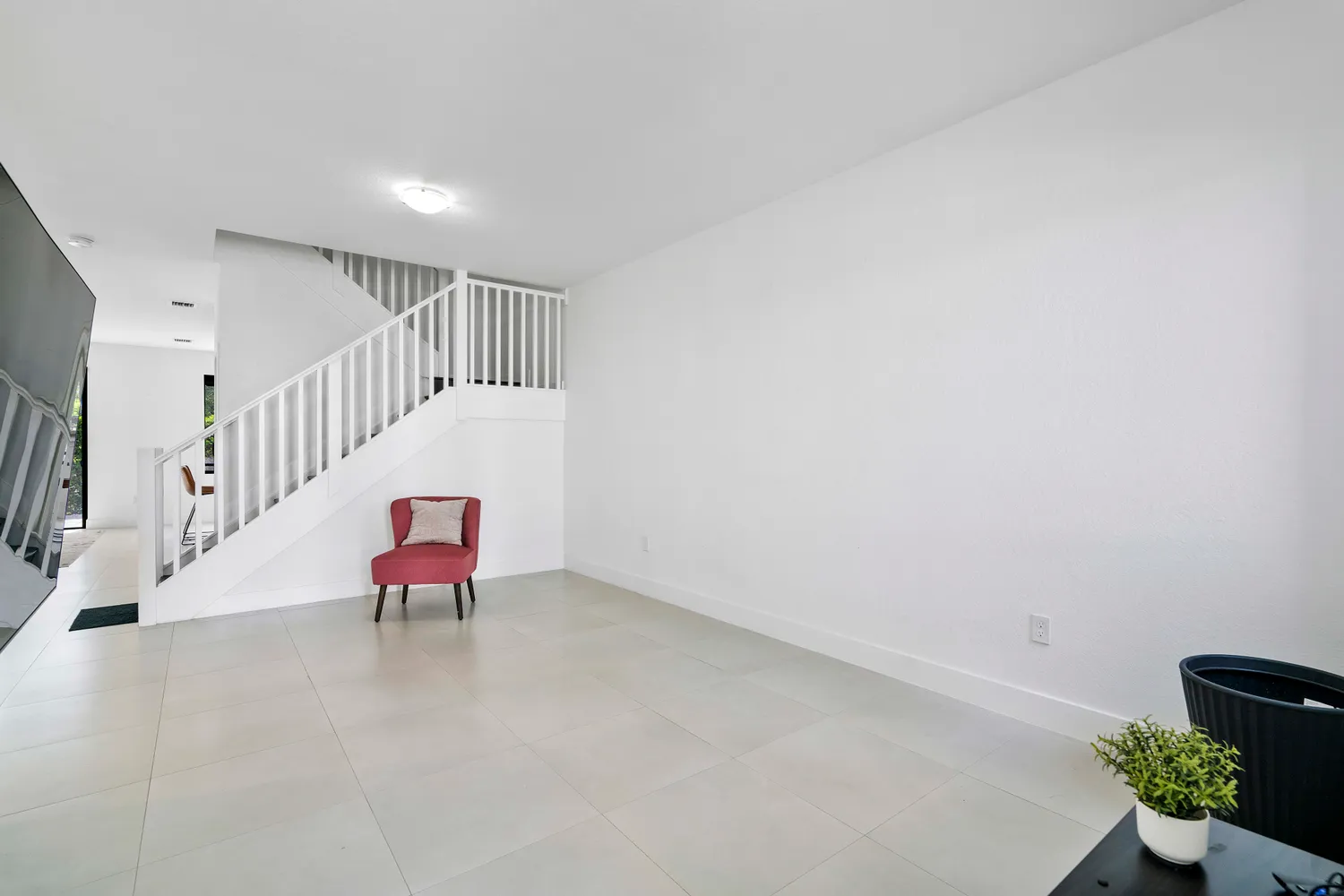 a room with chairs and stairs