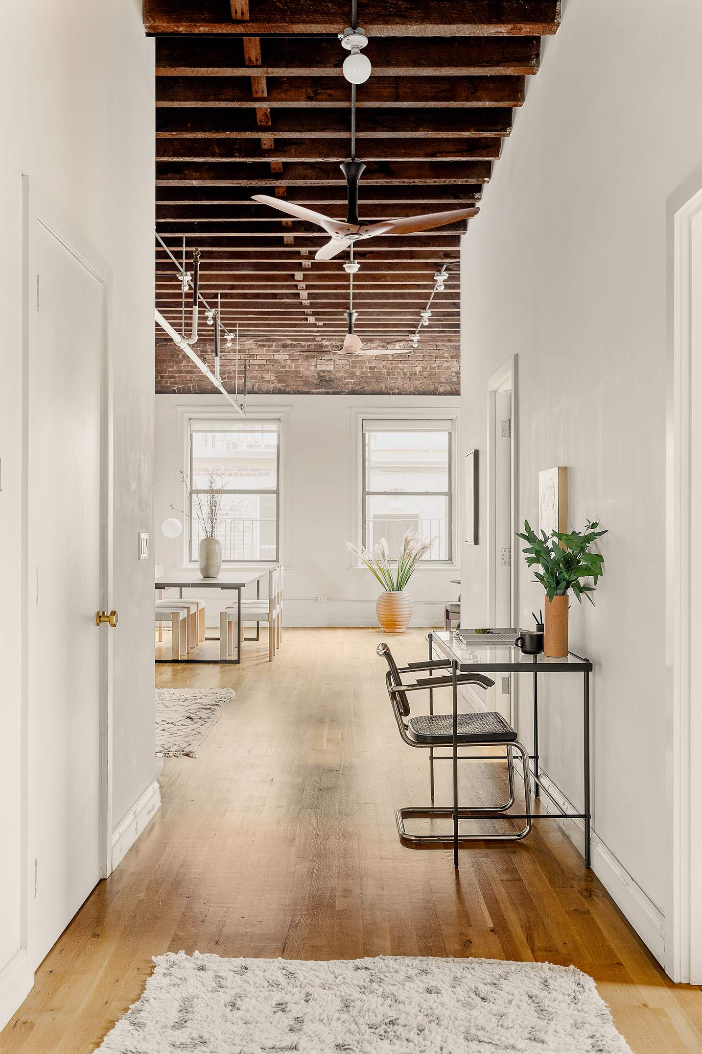 84 Forsyth Street, Unit 5R Manhattan, NY 10002 - Photo 5 of 14 a view of livingroom with furniture and window