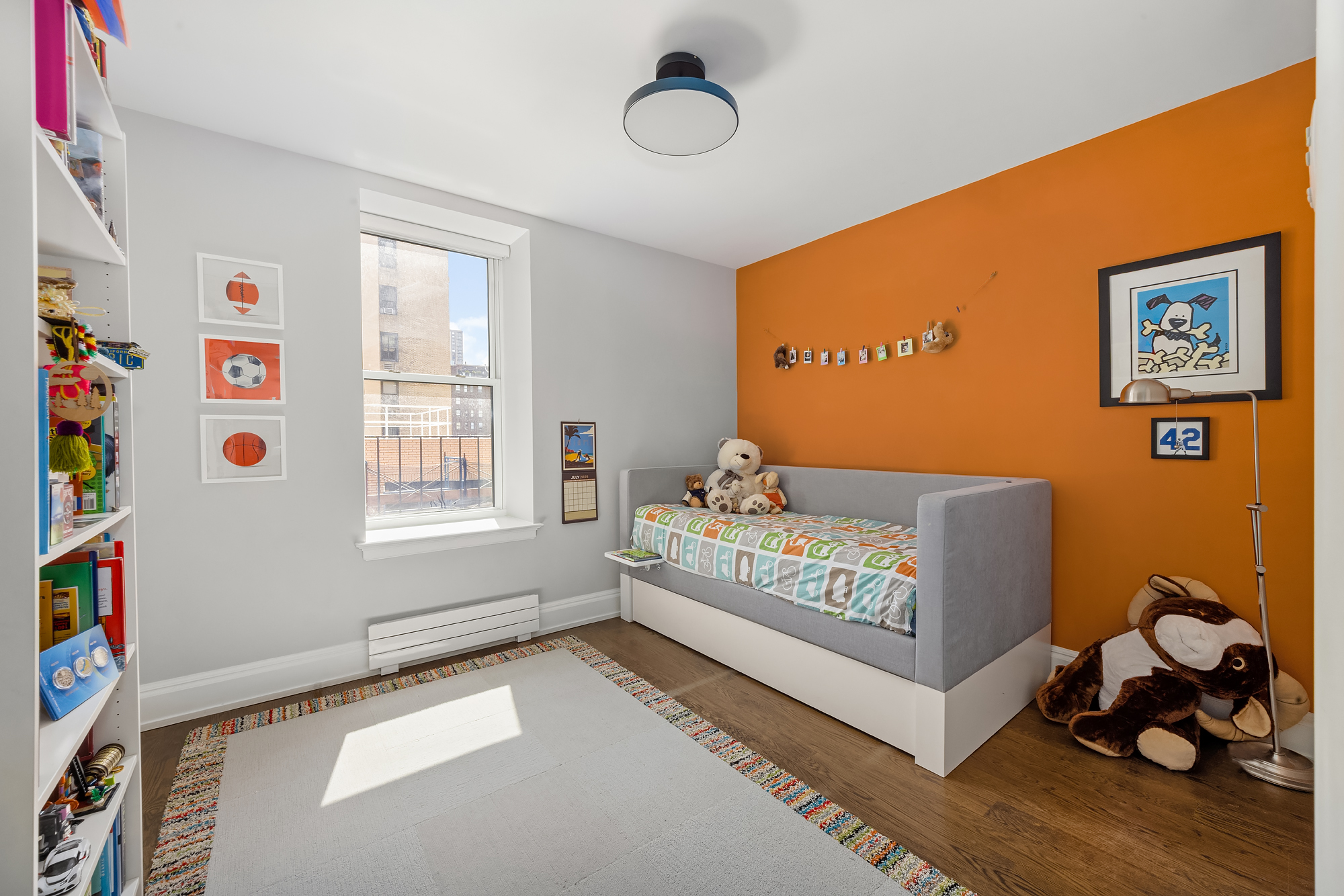 344 West 72nd Street, Unit 1007 Manhattan, NY 10023 - Photo 13 of 23 a bedroom with furniture and a window