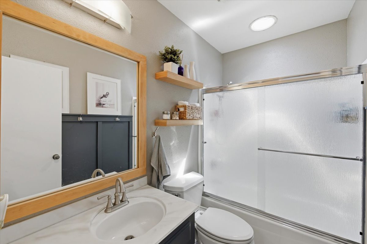 6373 Rancho Mission Road, Unit 5 San Diego, CA 92108 - Photo 21 of 30 a bathroom with a sink toilet and shower