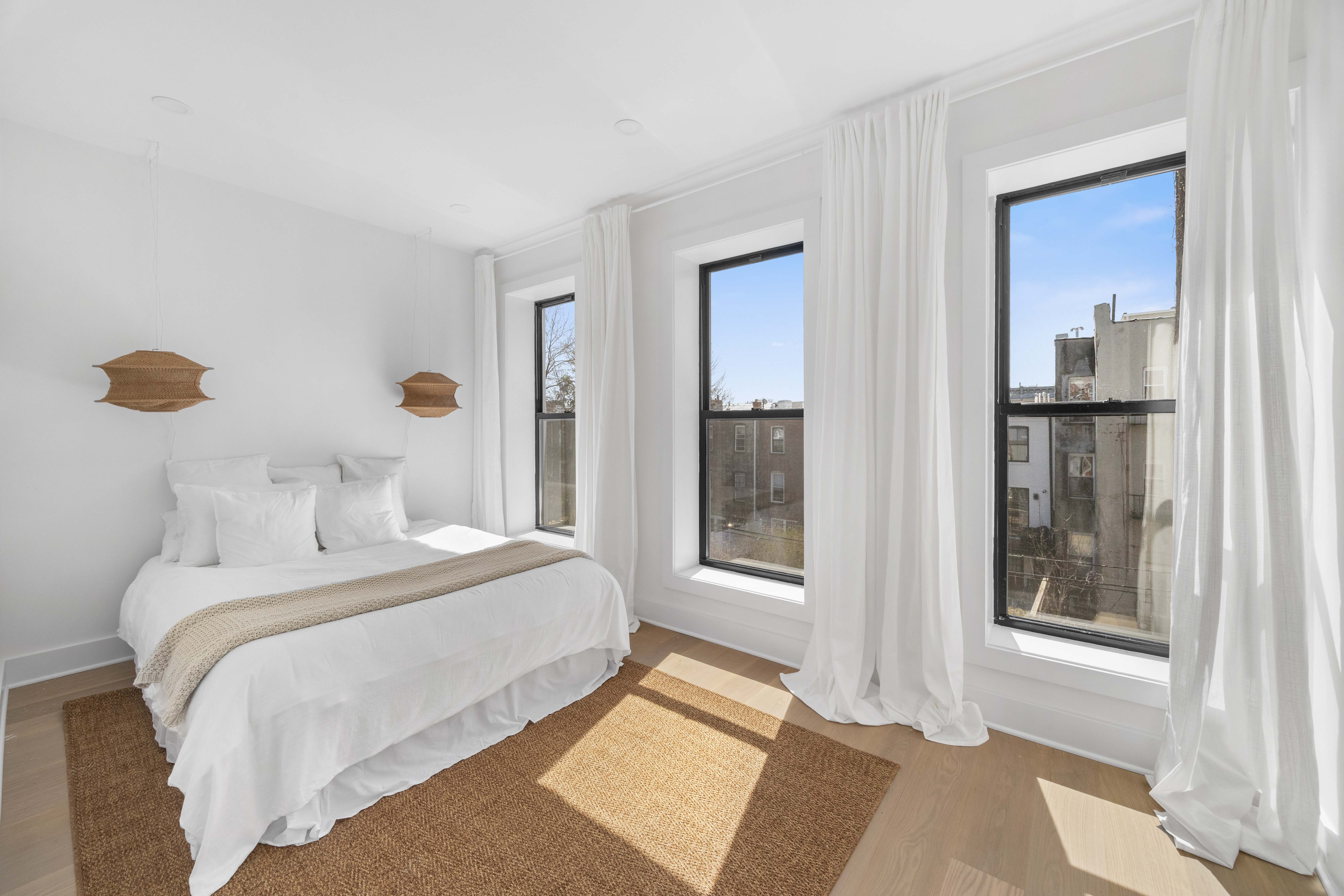 1000 Putnam Avenue Brooklyn, NY 11221 - Photo 6 of 18 a bedroom with a bed and a window