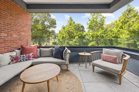 a outdoor living space with furniture and garden view
