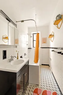 a bathroom with a sink a mirror and a shower