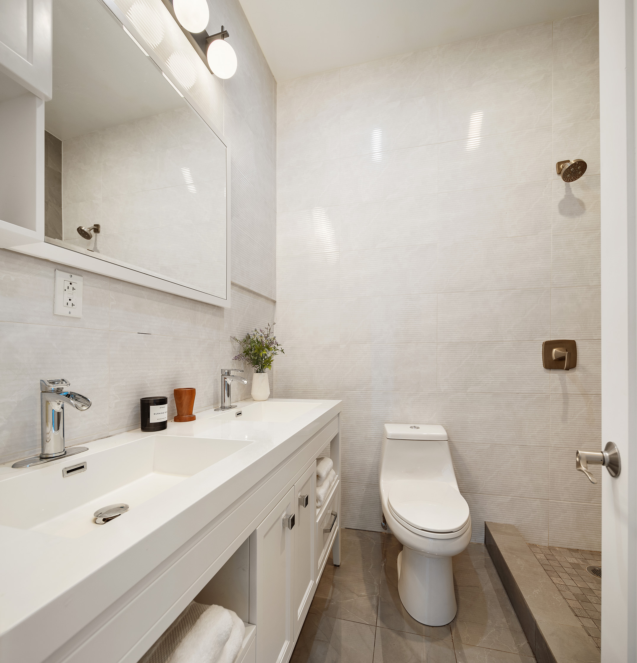 34 Woodbine Street Brooklyn, NY 11221 - Photo 13 of 15 a bathroom with a toilet sink and mirror