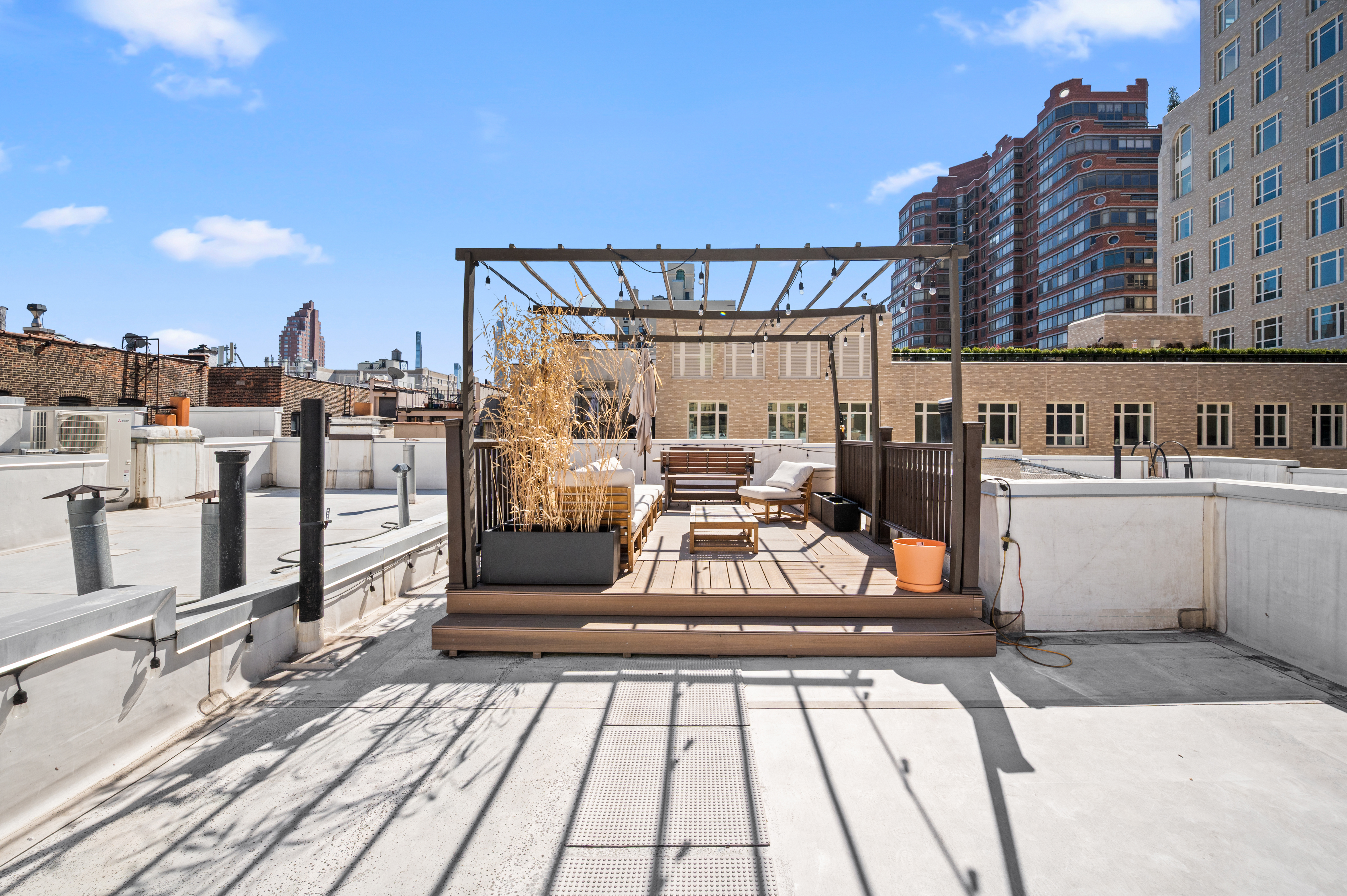 206 West 85th Street, Unit 5 Manhattan, NY 10024 - Photo 14 of 15 a view of a balcony with chairs and wooden floor