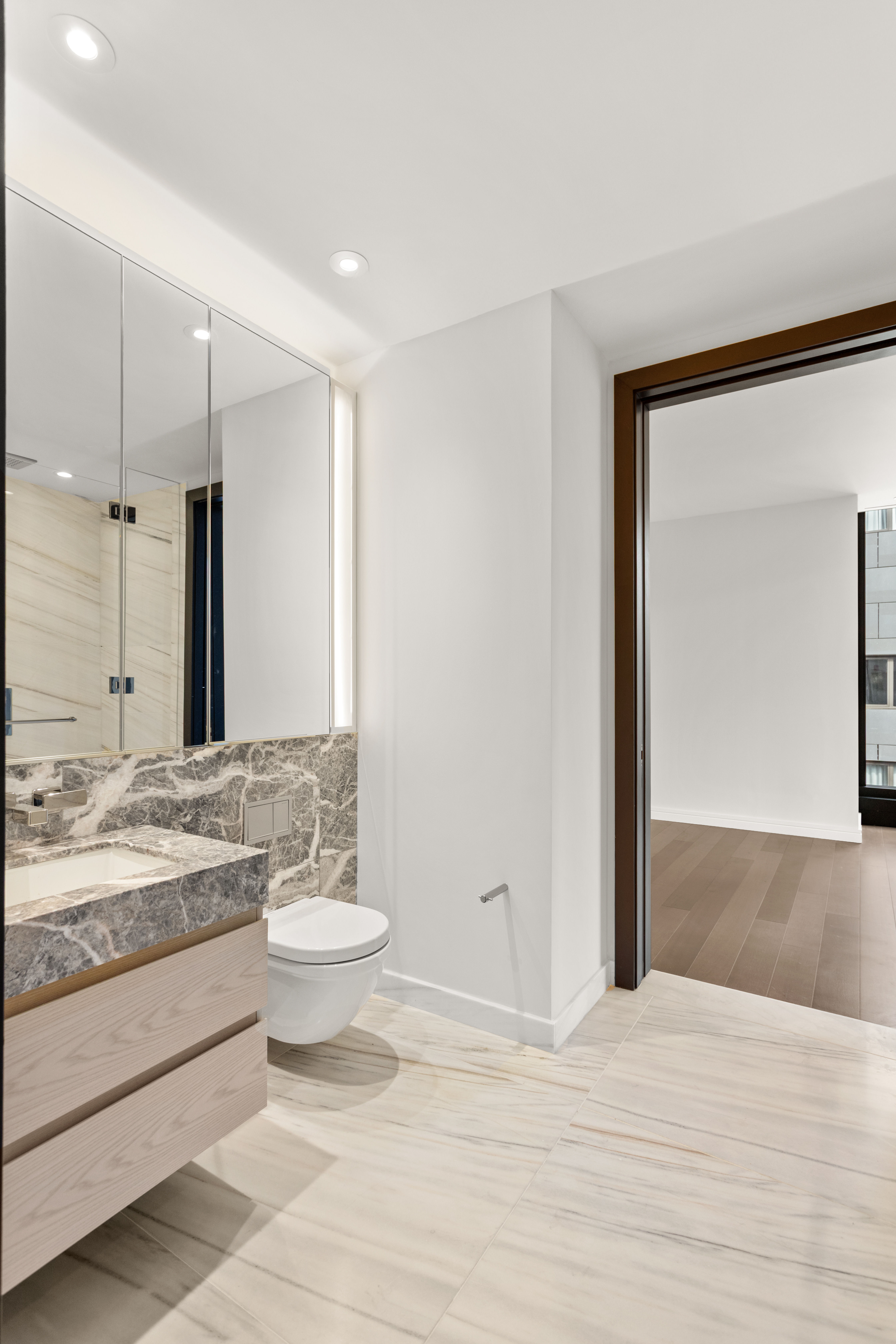 125 Greenwich Street, Unit 31A Manhattan, NY 10006 - Photo 12 of 23 a bathroom with a sink and a mirror