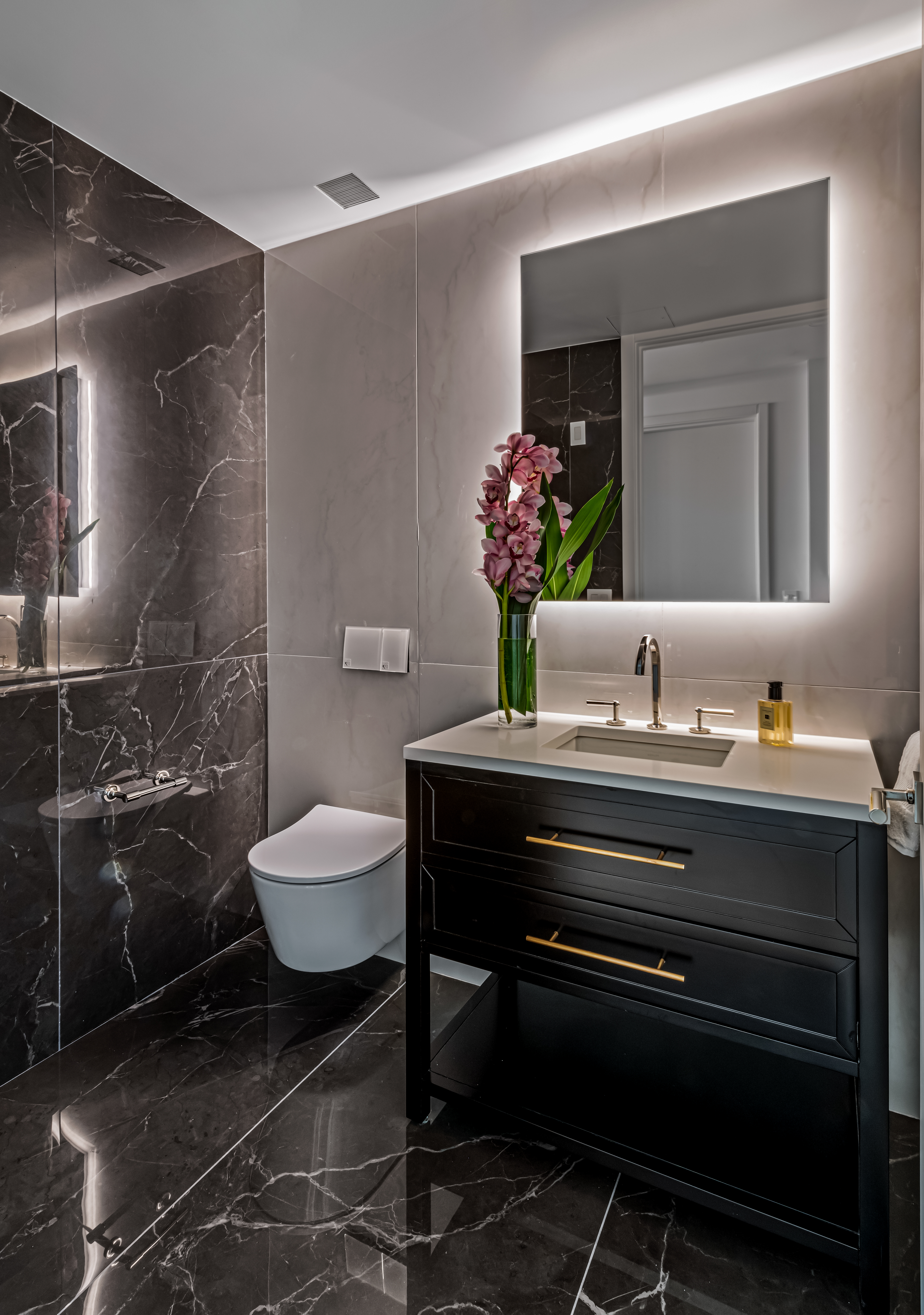420 East 75th Street, Unit 6 Manhattan, NY 10021 - Photo 6 of 25 a bathroom with a granite countertop sink a toilet and a mirror
