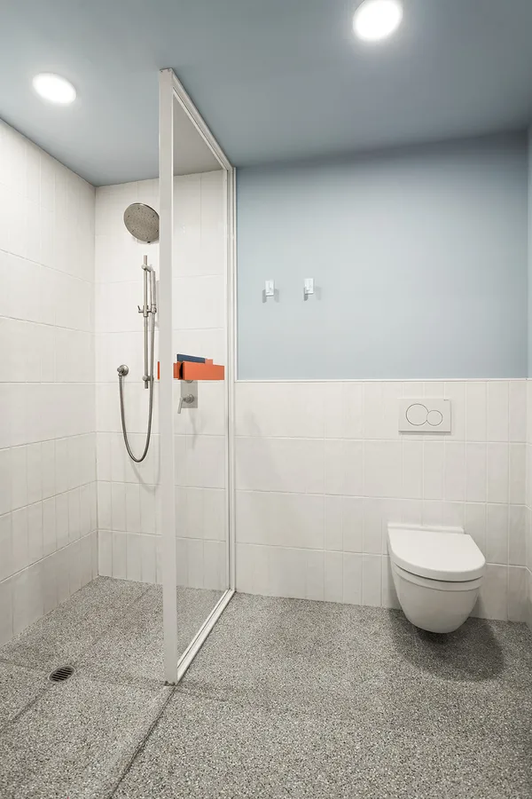 a bathroom with a granite countertop shower and a sink