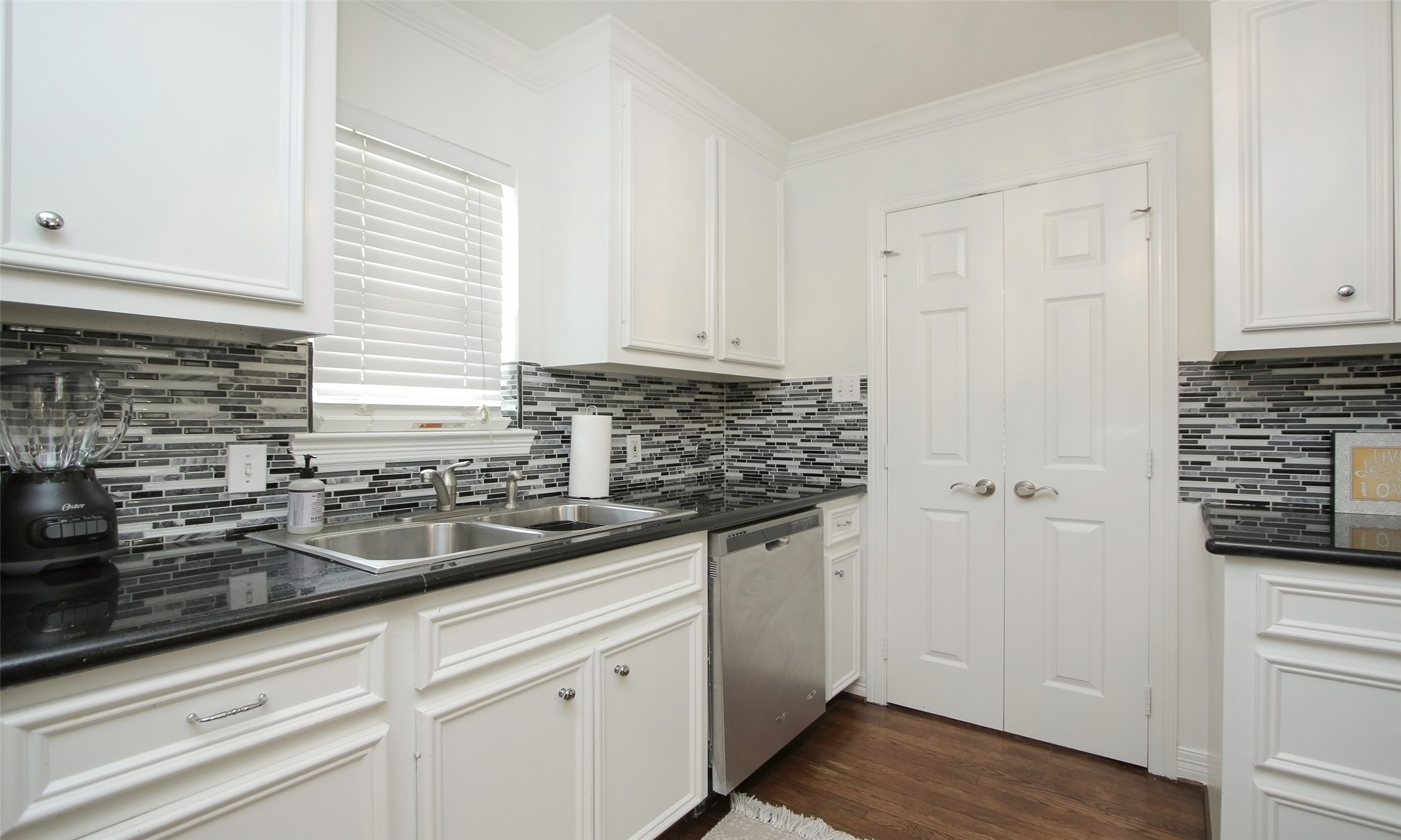 4331 Marina Street, Unit B Houston, TX 77007 - Photo 18 of 37 a kitchen with granite countertop white cabinets and white appliances