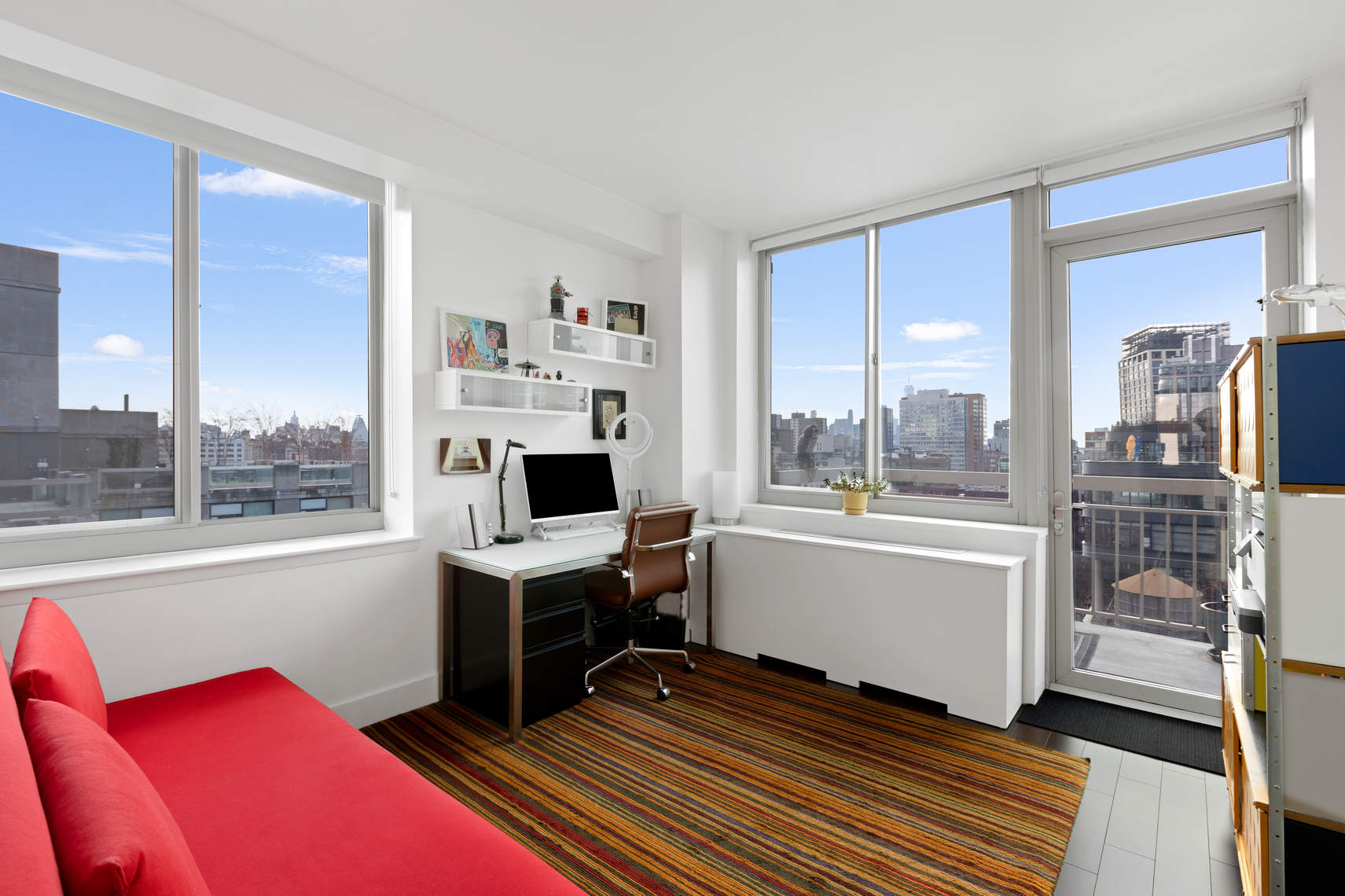 520 West 23rd Street, Unit PH16F Manhattan, NY 10011 - Photo 6 of 17 a view of a workspace with furniture and a window