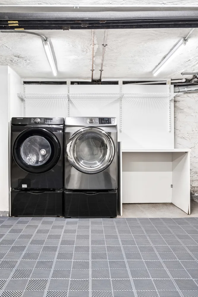 a close view of a stove top oven and cabinets