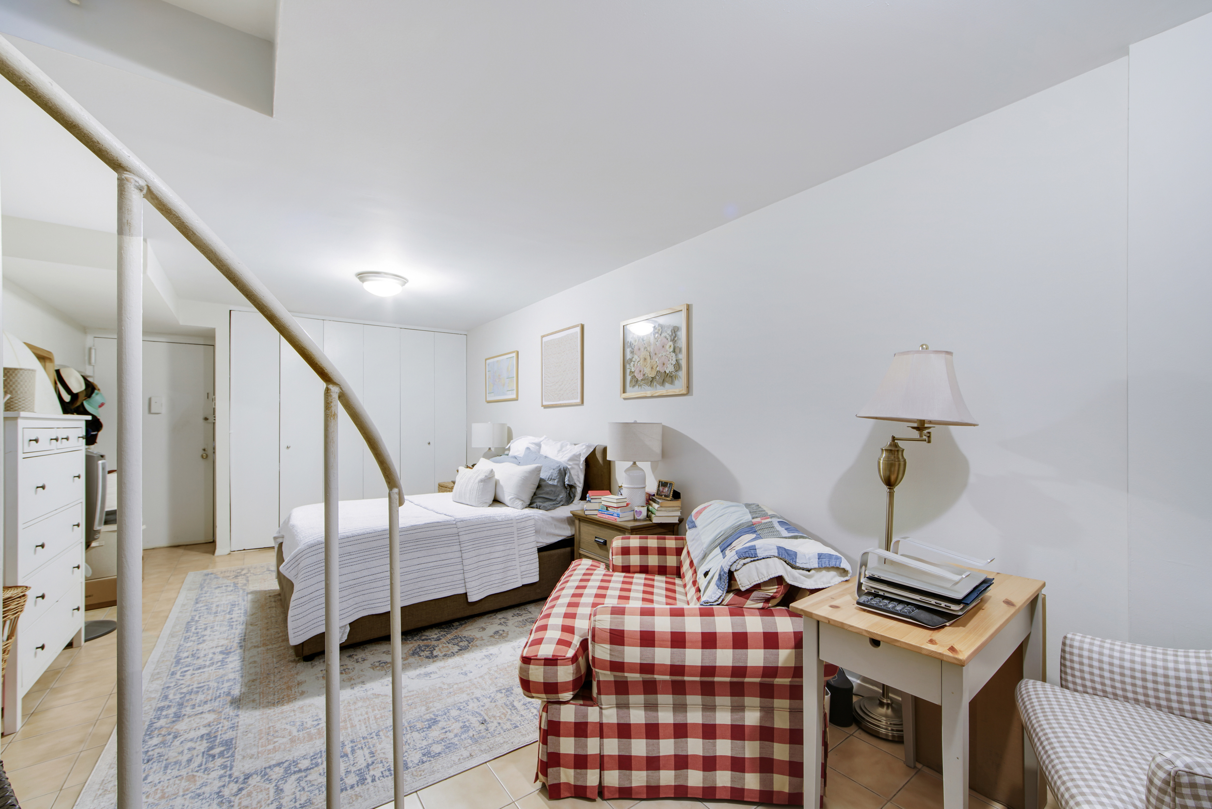 417 East 90th Street, Unit 1G Manhattan, NY 10128 - Photo 7 of 10 a bedroom with furniture and wooden floor