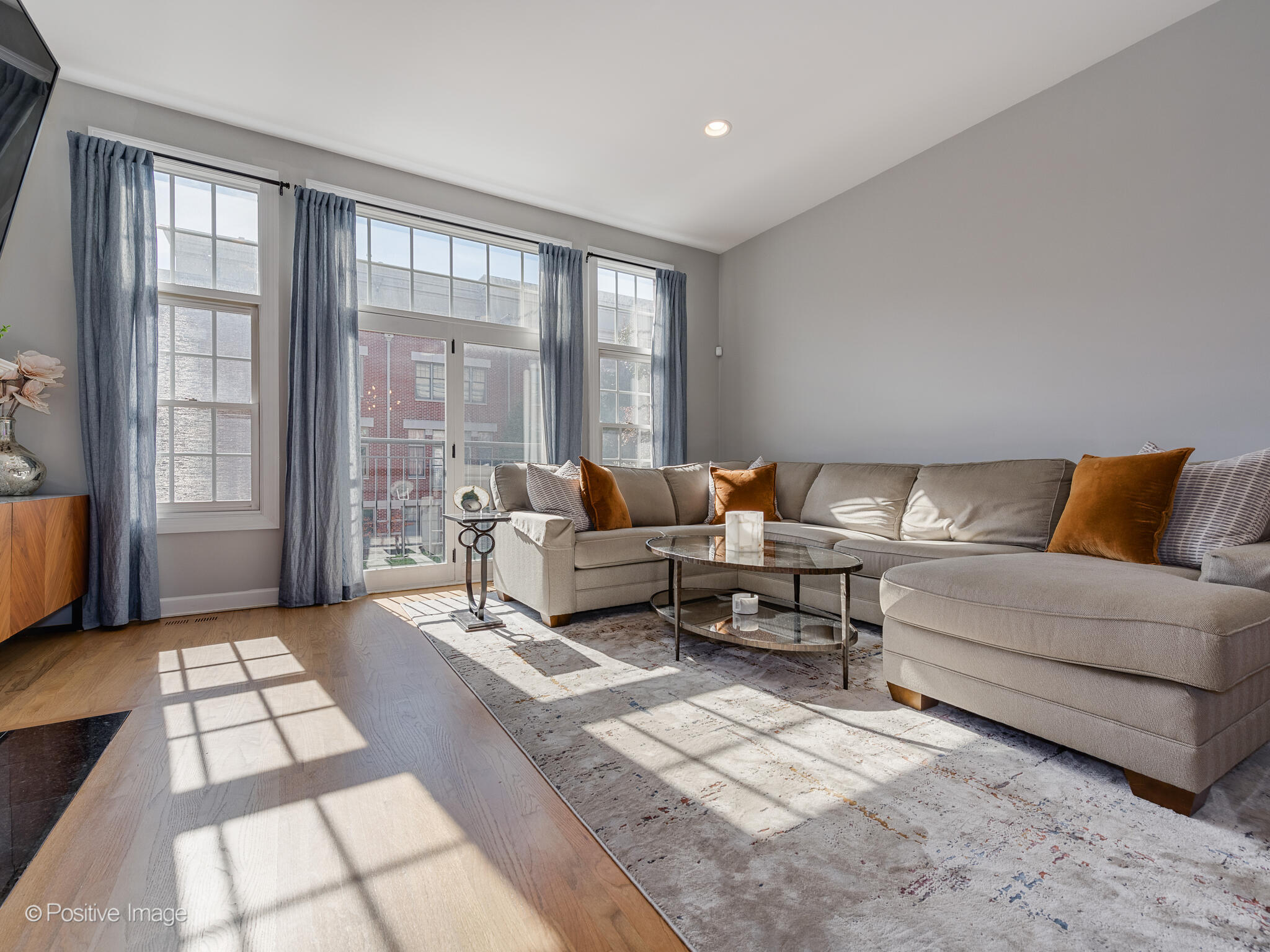 855 North May Street, Unit G Chicago, IL 60642 - Photo 7 of 28 a living room with furniture and a floor to ceiling window