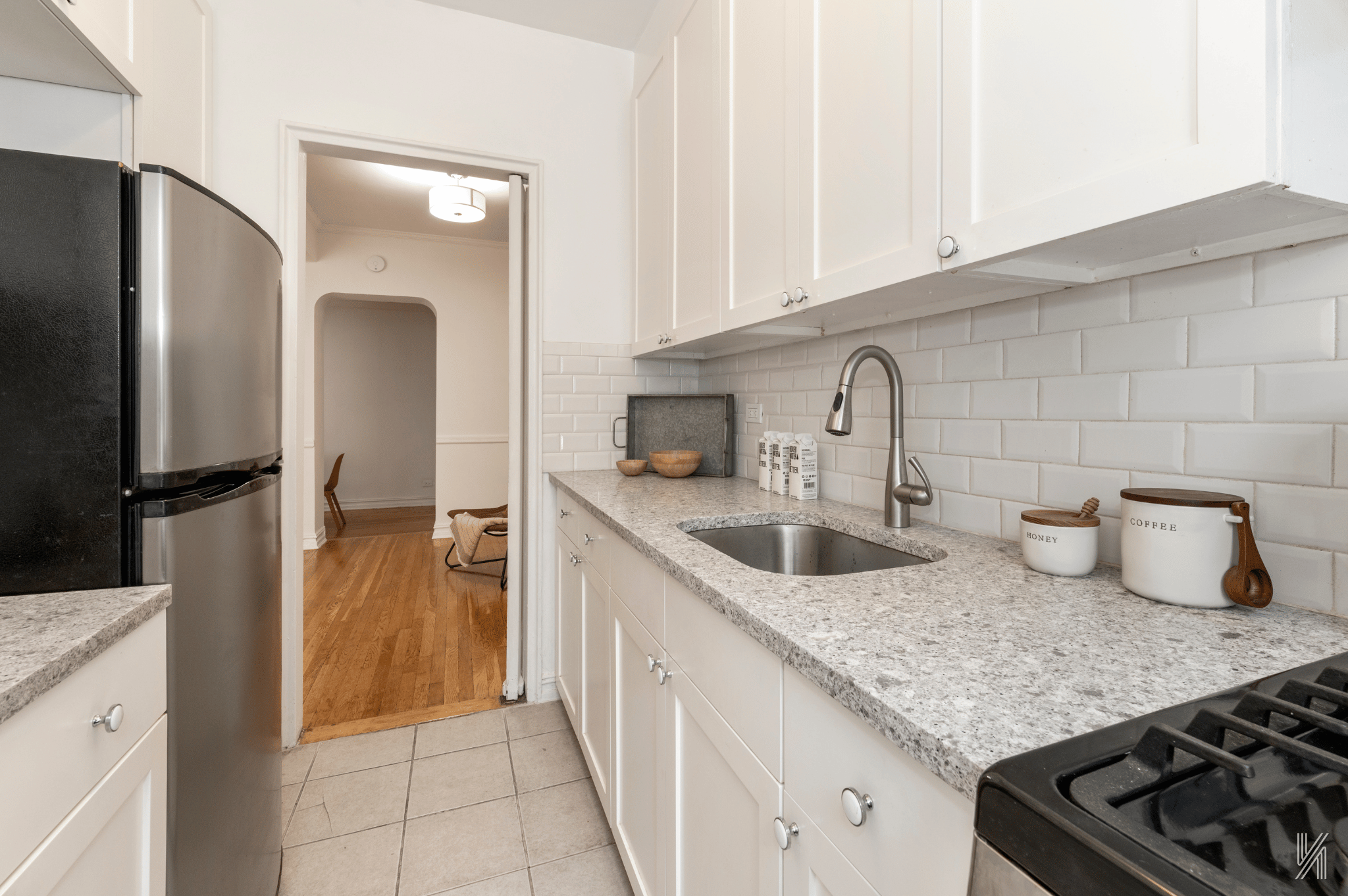 35-35 75th Street, Unit 428 Queens, NY 11372 - Photo 12 of 21 a kitchen with sink and refrigerator