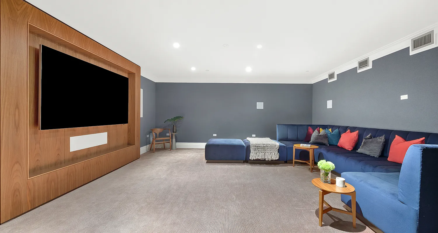 100 Barclay Street, Unit 21AD Manhattan, NY 10007 - Photo 35 of 37 a living room with furniture and a flat screen tv