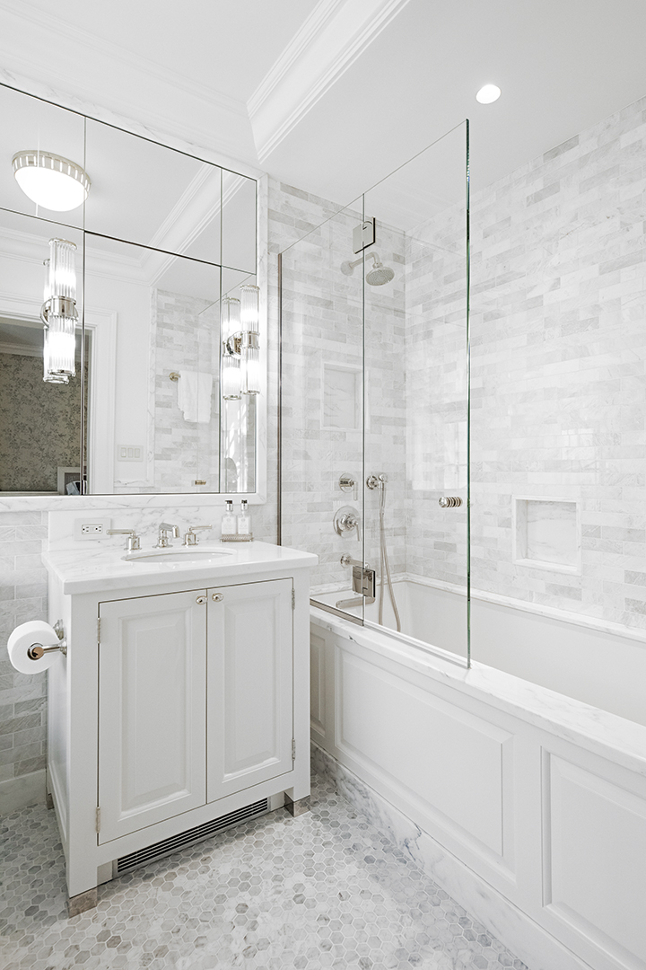 730 Park Avenue, Unit 7/8A Manhattan, NY 10021 - Photo 22 of 26 a bathroom with a double vanity sink a toilet and shower