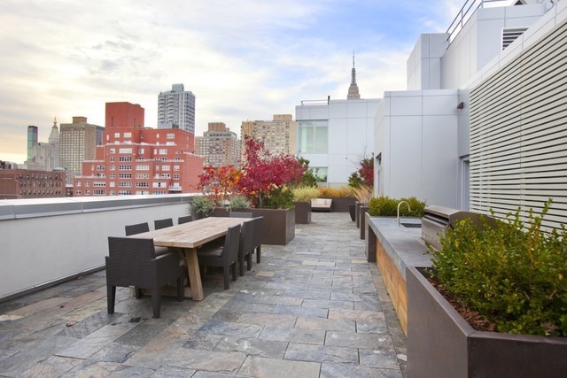 303 East 33rd Street, Unit B2 Manhattan, NY 10016 - Photo 14 of 24 a terrace with outdoor seating and city view