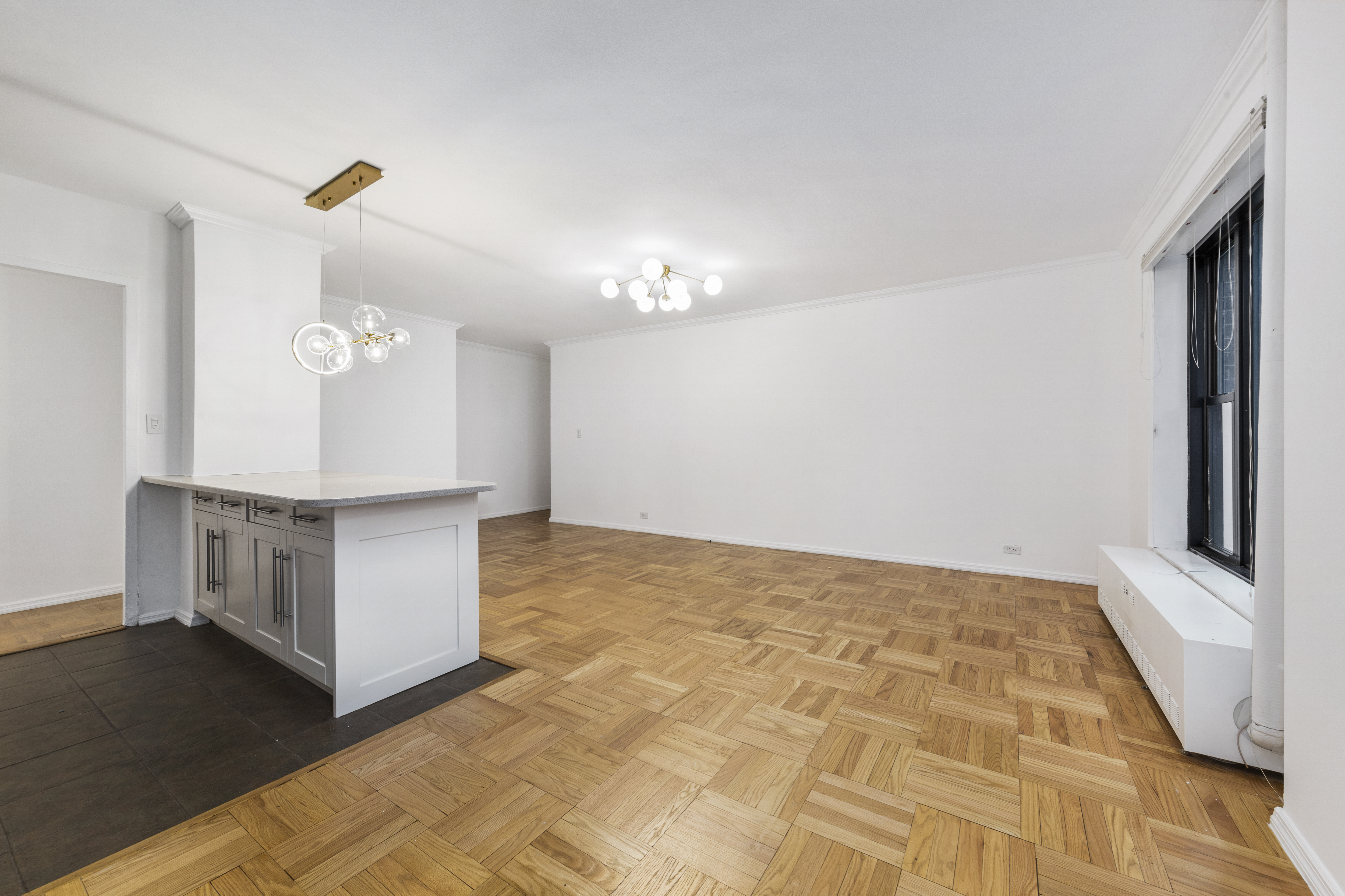 355 Clinton Avenue, Unit F1 Brooklyn, NY 11238 - Photo 14 of 20 a view of a kitchen with cabinets and wooden floor