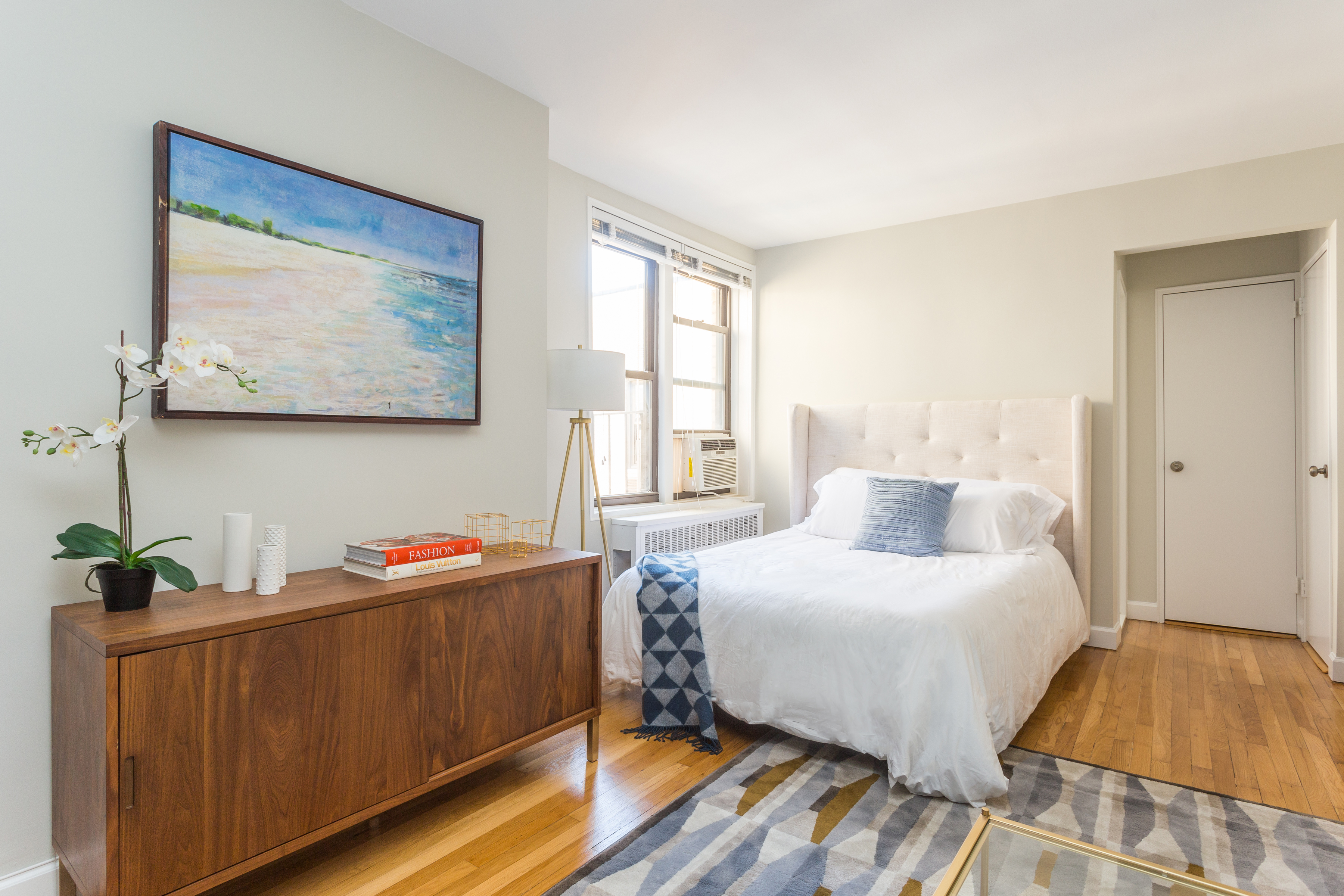 85 4th Avenue, Unit 7JJ Manhattan, NY 10003 - Photo 2 of 7 a bedroom with bed and wooden floor