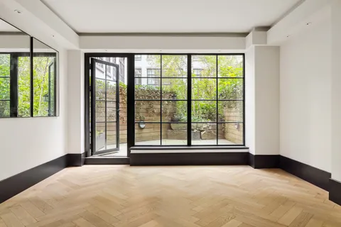 a view of a bedroom with large windows