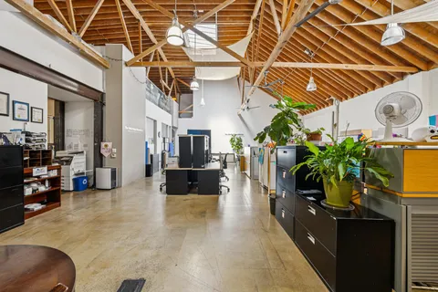 a kitchen with stainless steel appliances a refrigerator a stove a microwave and cabinets