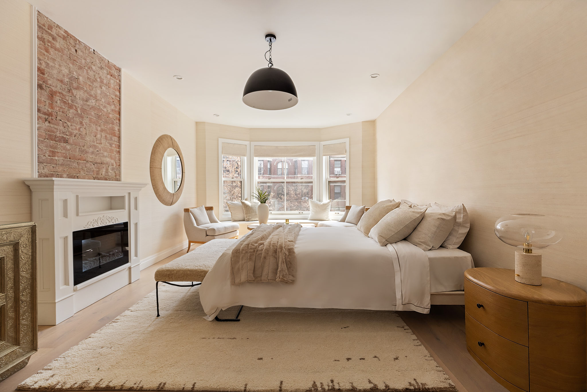 143 Milton Street Brooklyn, NY 11222 - Photo 10 of 19 a bedroom with a bed a fireplace and a window