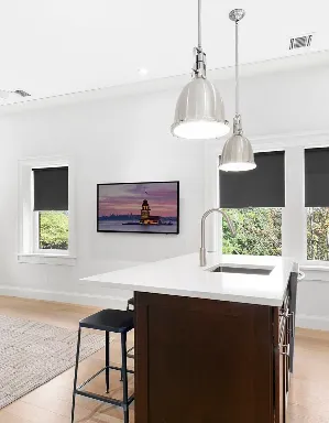 a kitchen with stainless steel appliances a sink a stove a refrigerator and cabinets