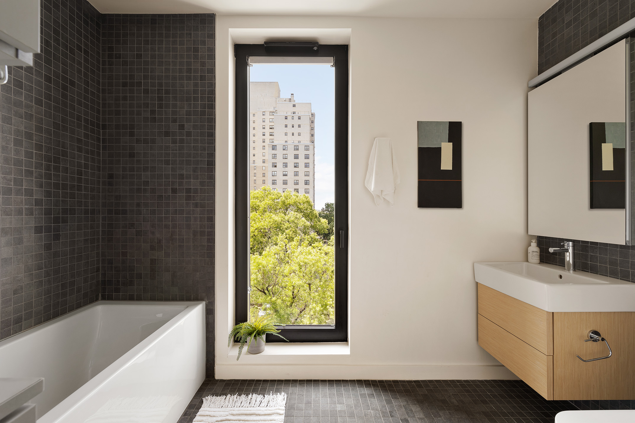 8 St Marks Place, Unit 6A Brooklyn, NY 11217 - Photo 5 of 11 a bathroom with a tub sink and mirror