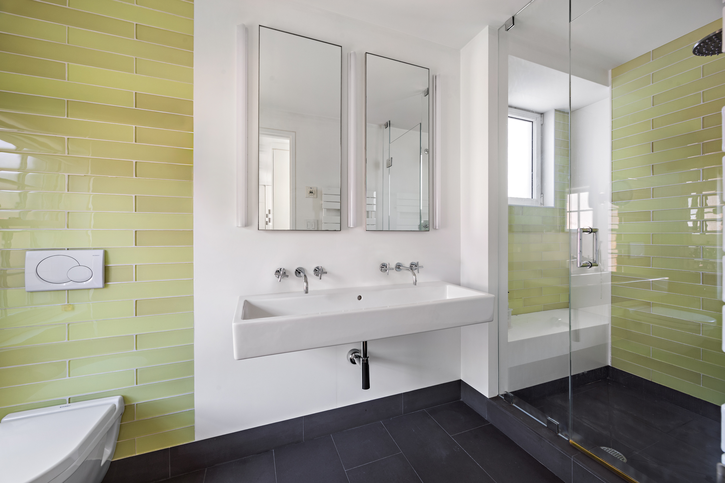 39 Barrow Street Manhattan, NY 10014 - Photo 29 of 39 a bathroom with a sink a shower and a mirror